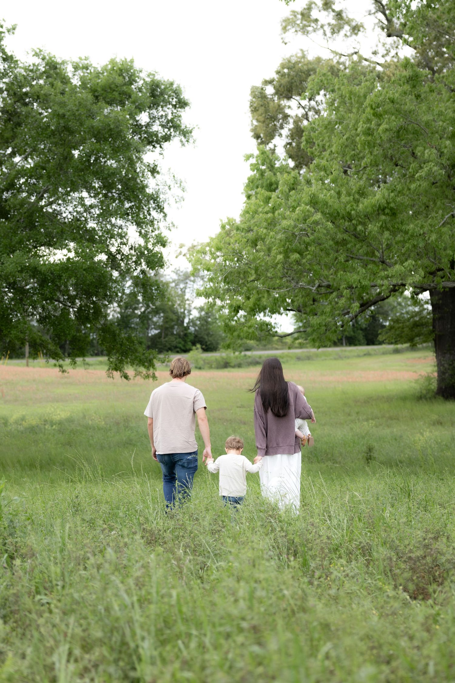 Candid family photos in a grass field | Dothan, Alabama Lifestyle Portrait Photographer