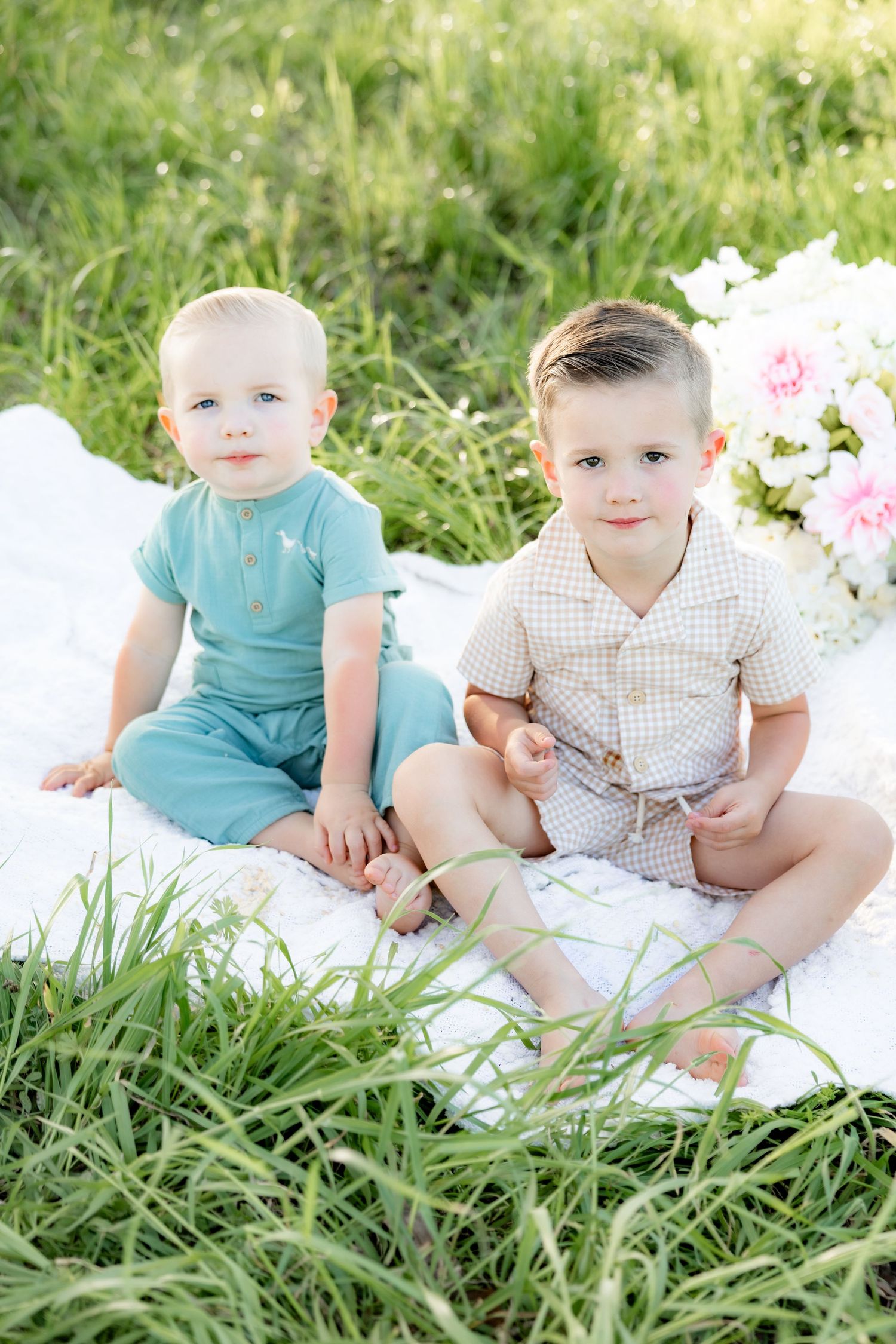 Spring Mini Session with baby chicks in a grass field at sunset near Dothan, Alabama