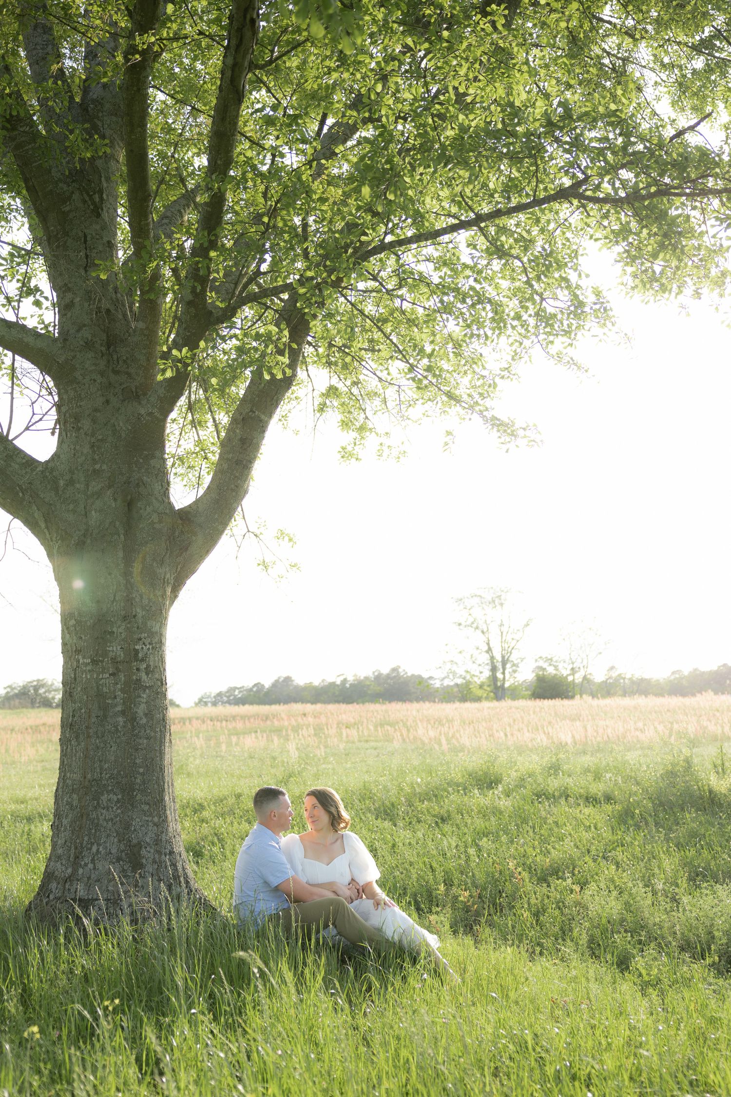 Storytelling romantic couple photos in a tall grass field at sunset in Dothan, Alabama
