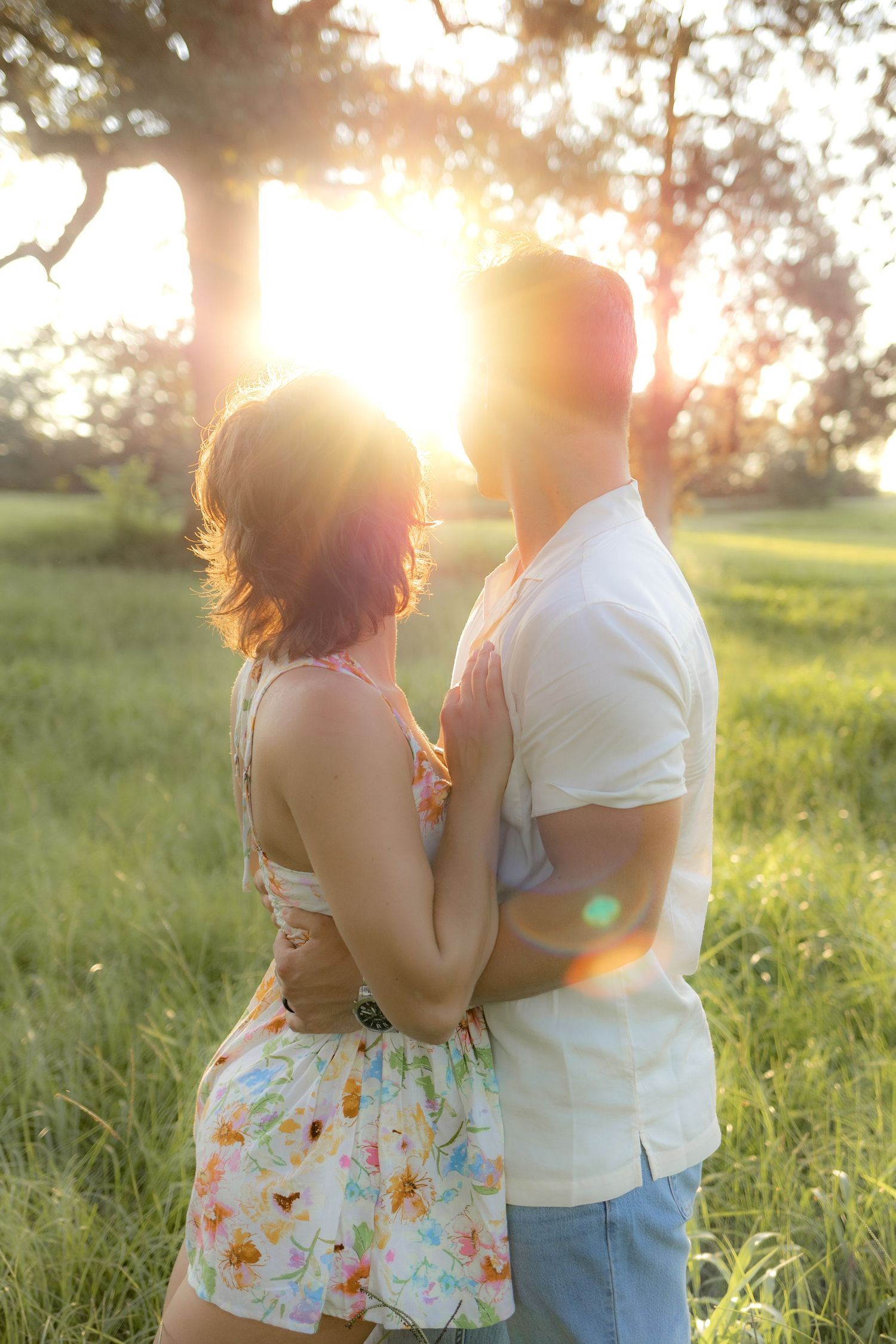 Romantic Couples photos in a tall grass field at sunset near Dothan, Alabama