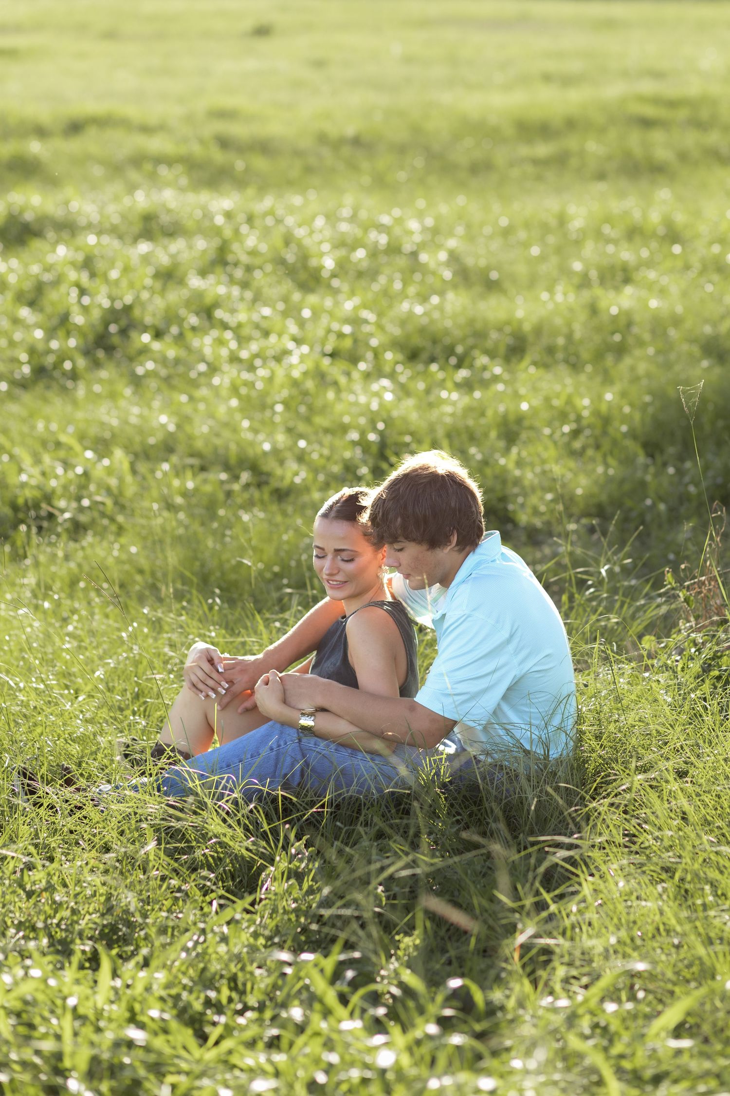 Romantic Couples photos in a tall grass field at sunset near Dothan, Alabama