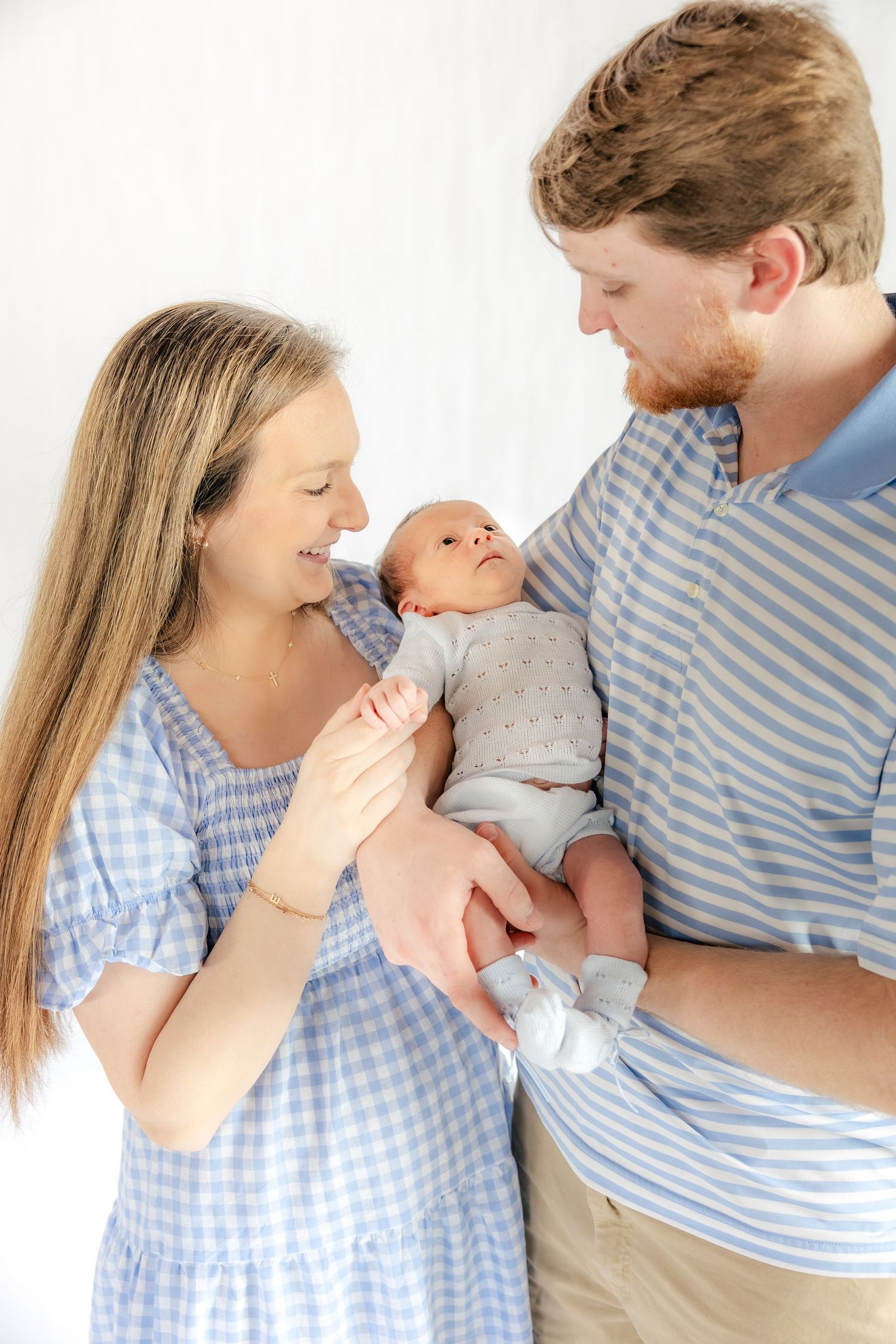 Family holding their baby in a studio in Dothan, Alabama