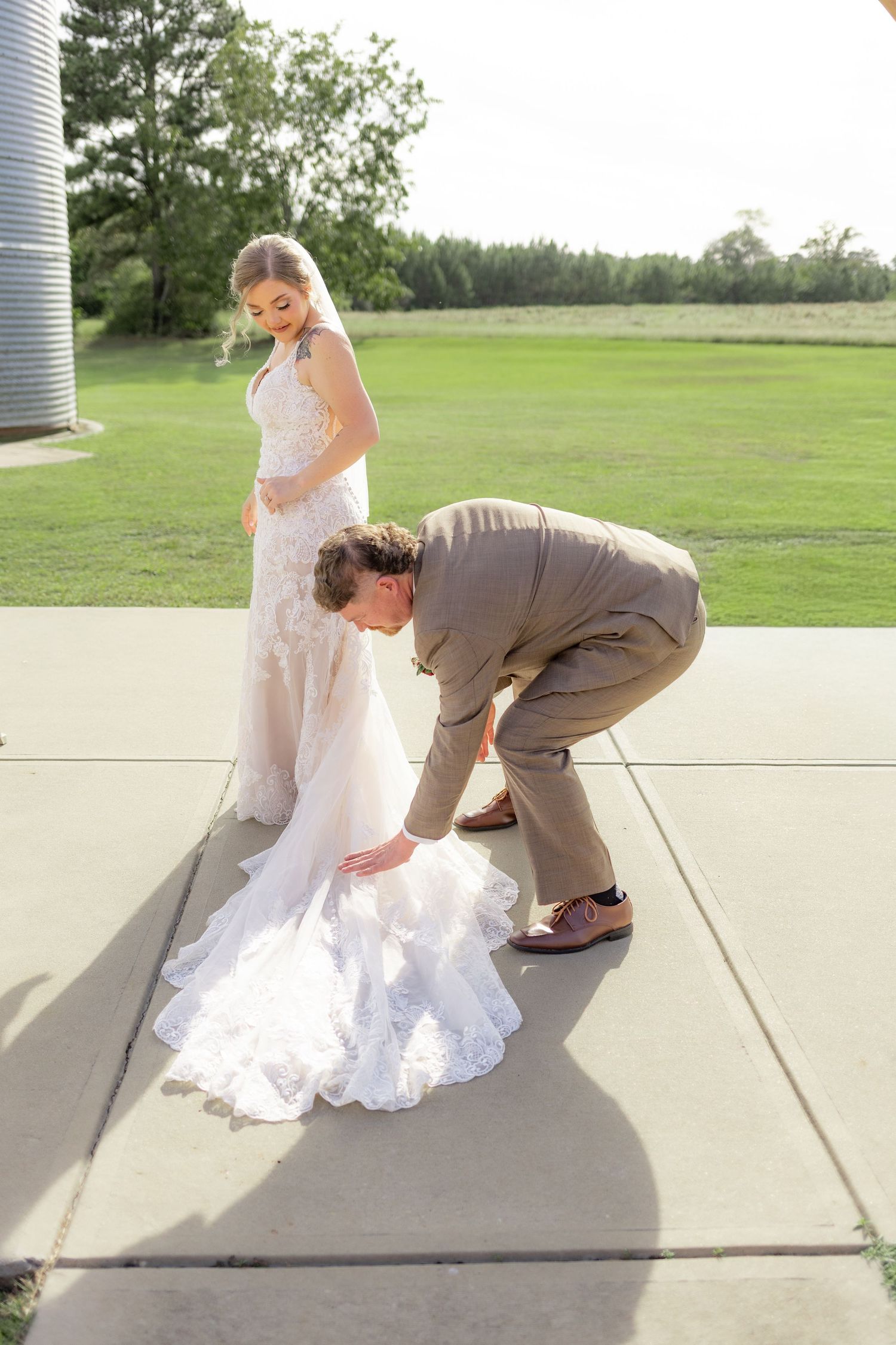 Groom first look with bride underneath the gazebo at Hilltop Acres Wicksburg, Alabama