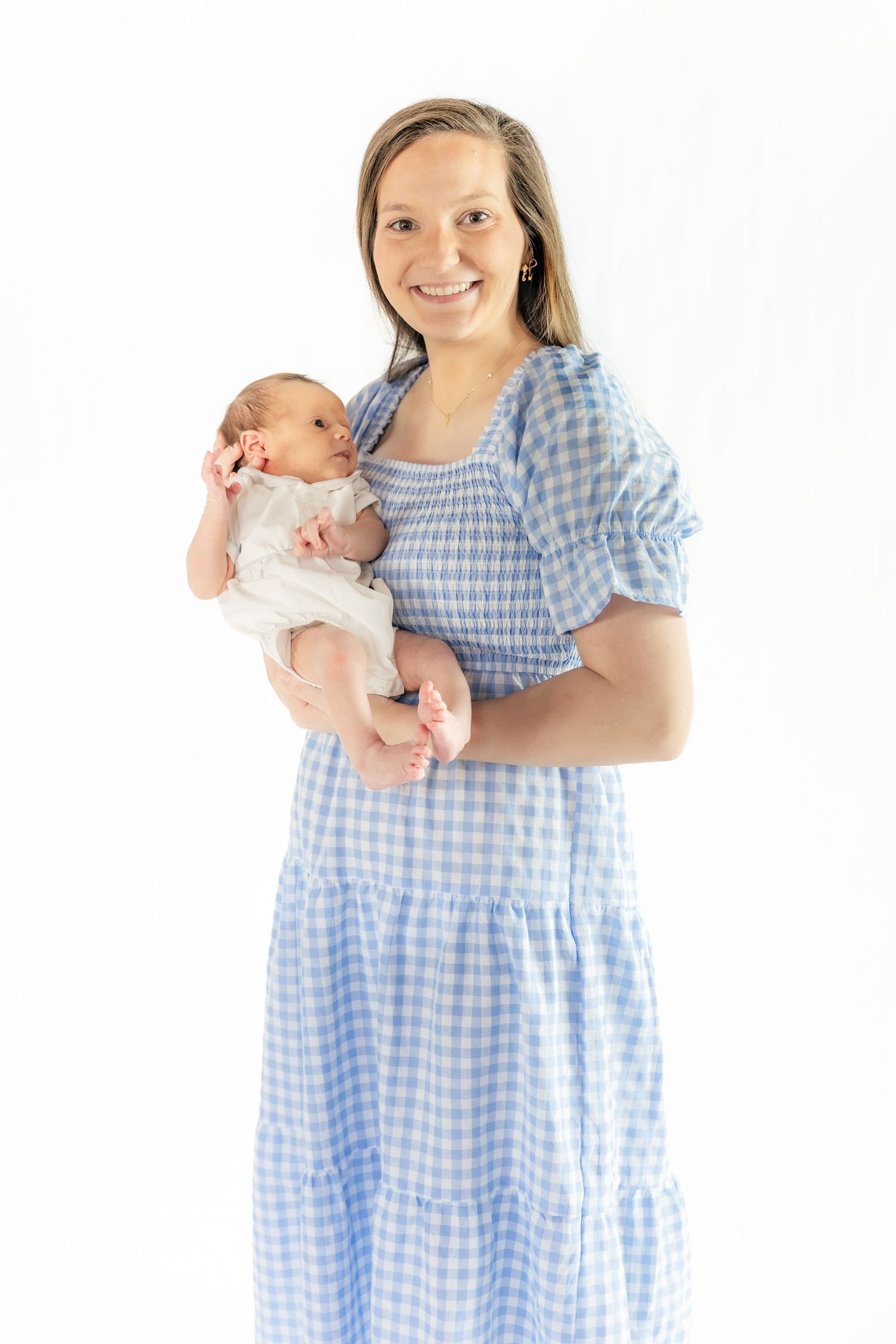 Mother holding her baby in a Studio in Dothan, Alabama