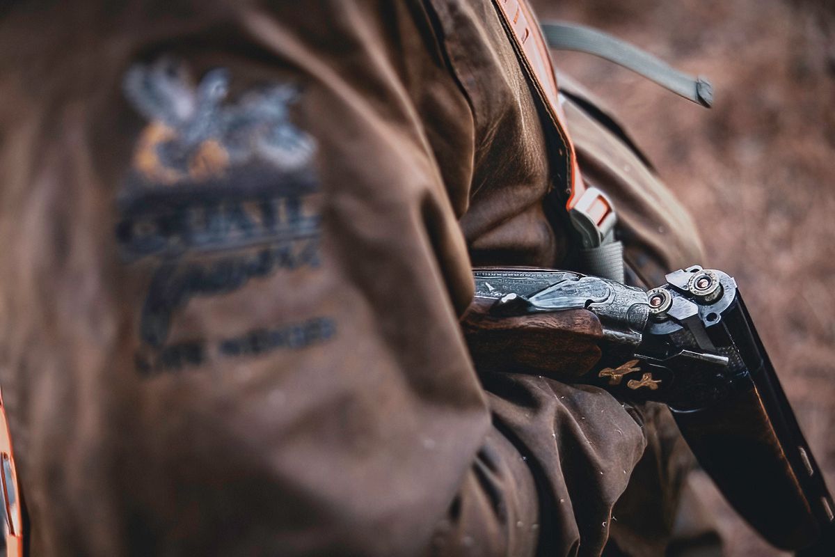 Close-up detail of hunting gear and equipment in brown tones.