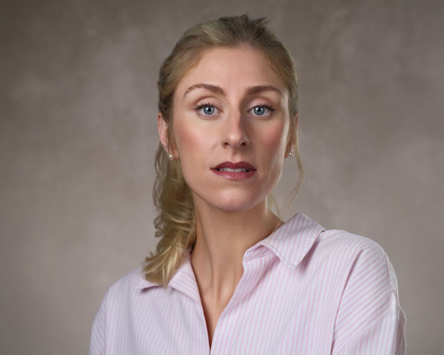 A sequence of headshots showing different expressions and poses against a neutral gray background.