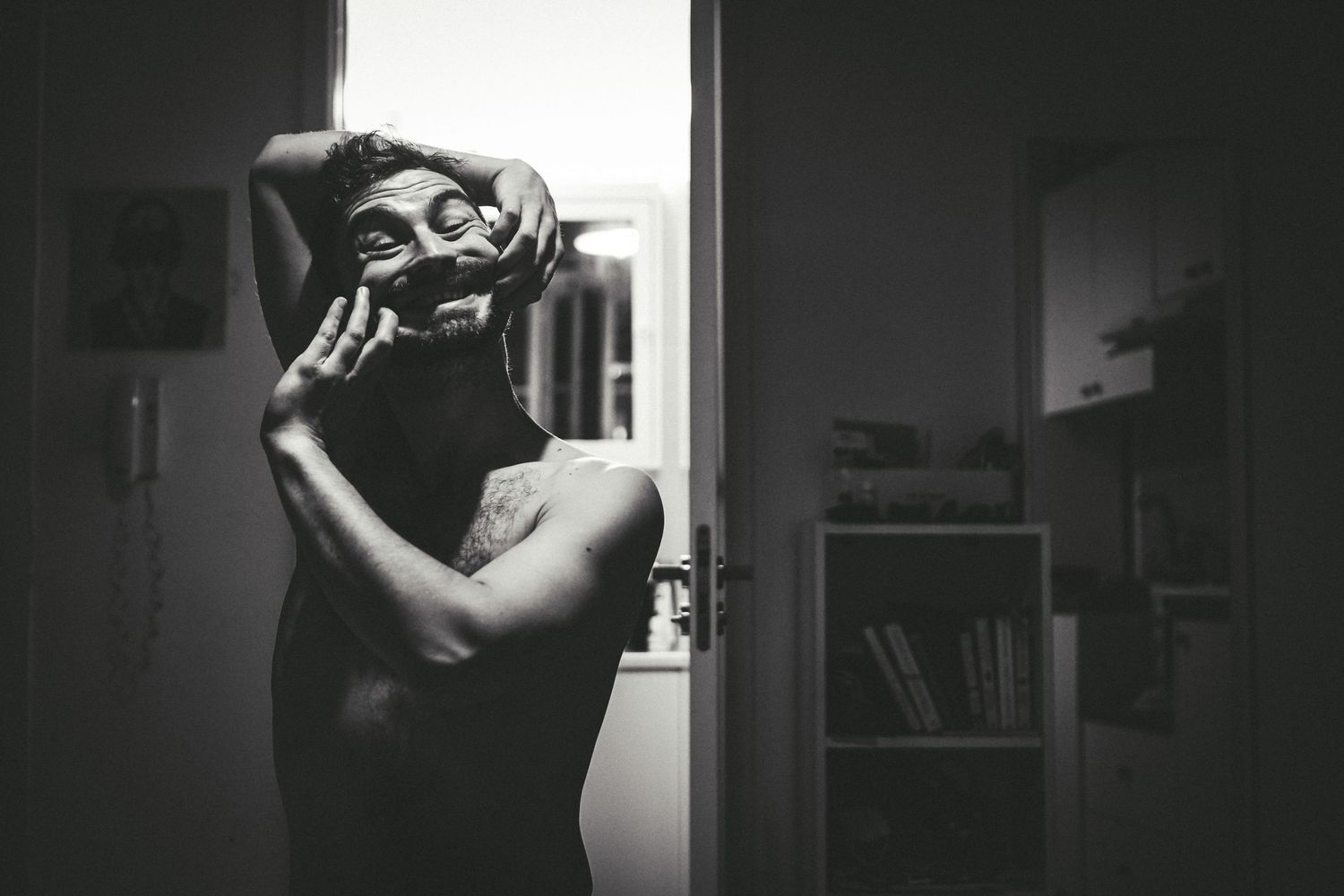 Dramatic black and white photo series showing silhouettes through window light.