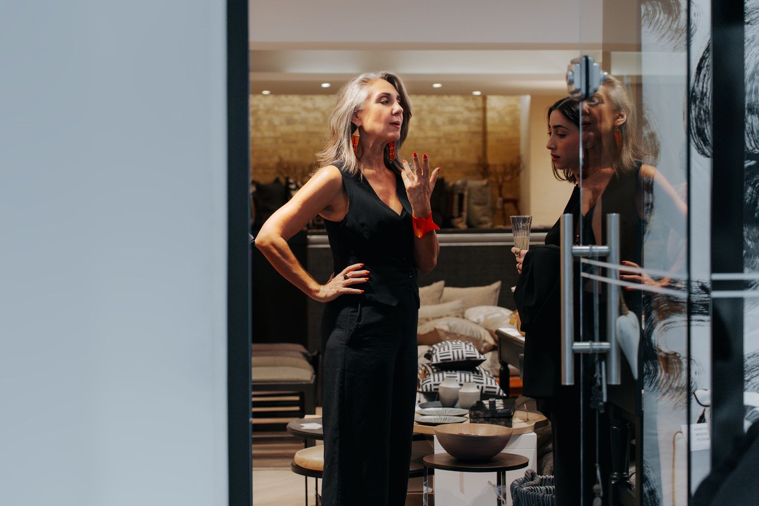 Modern retail store interior with glass windows and minimalist design elements.
