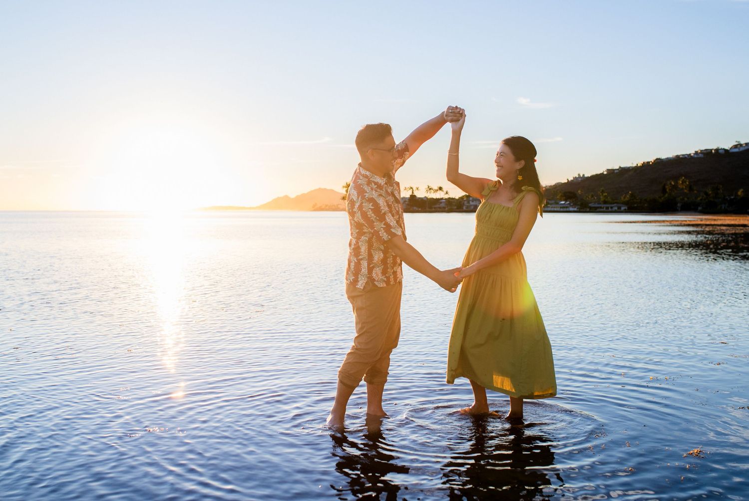 Husband and wife couple photography at sunset in Hawaii