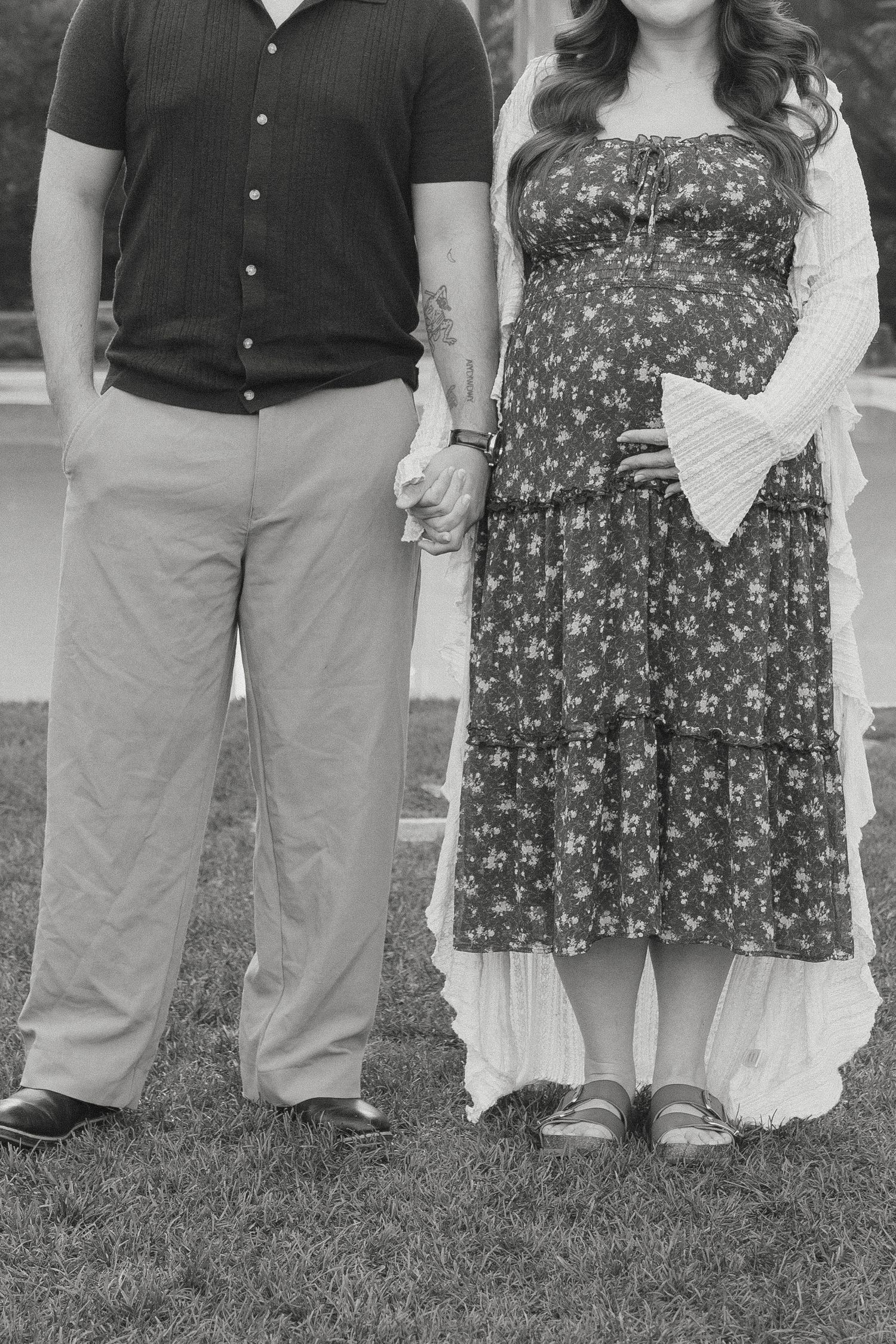 A couple holding hands for a maternity belly bump close up in Redwood City, CA