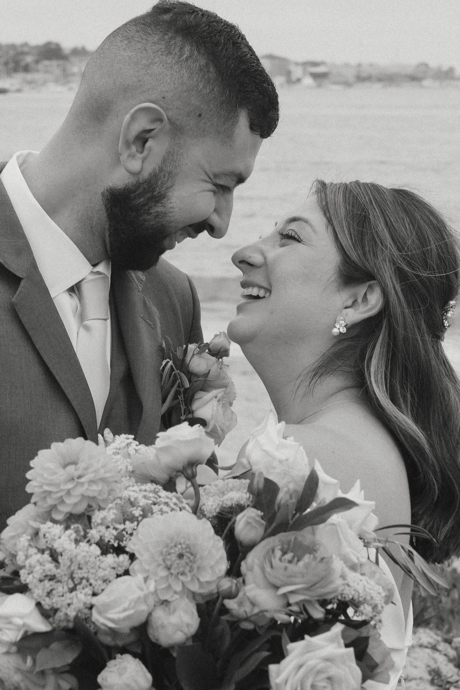 A newly married couple sharing a smile as they elope in Monterey, CA