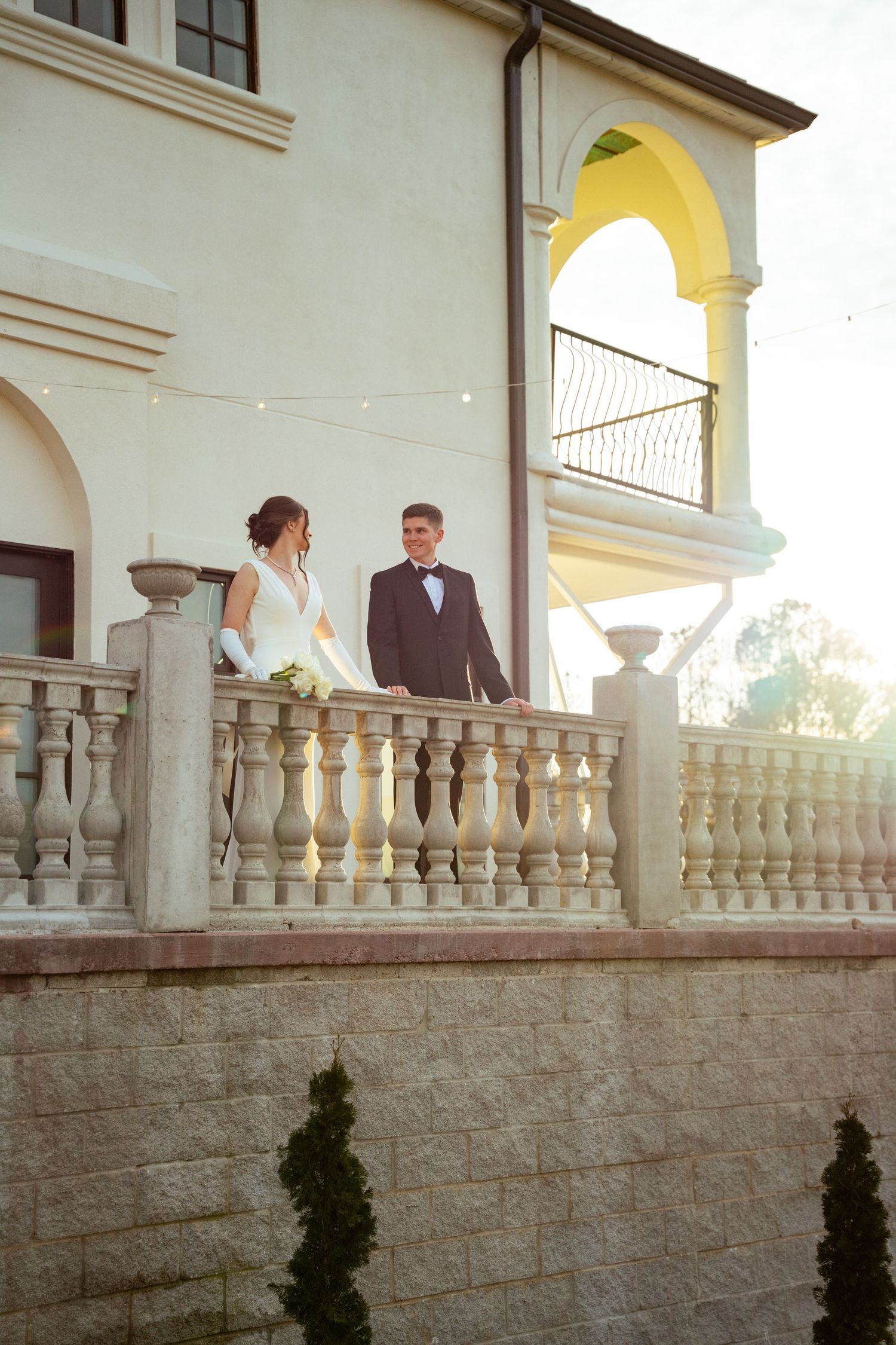 Sparta wedding, golden hour photo, terrace with sun behind, luxury Sparta wedding venue at sunset, elegant wedding couple in Tennessee.