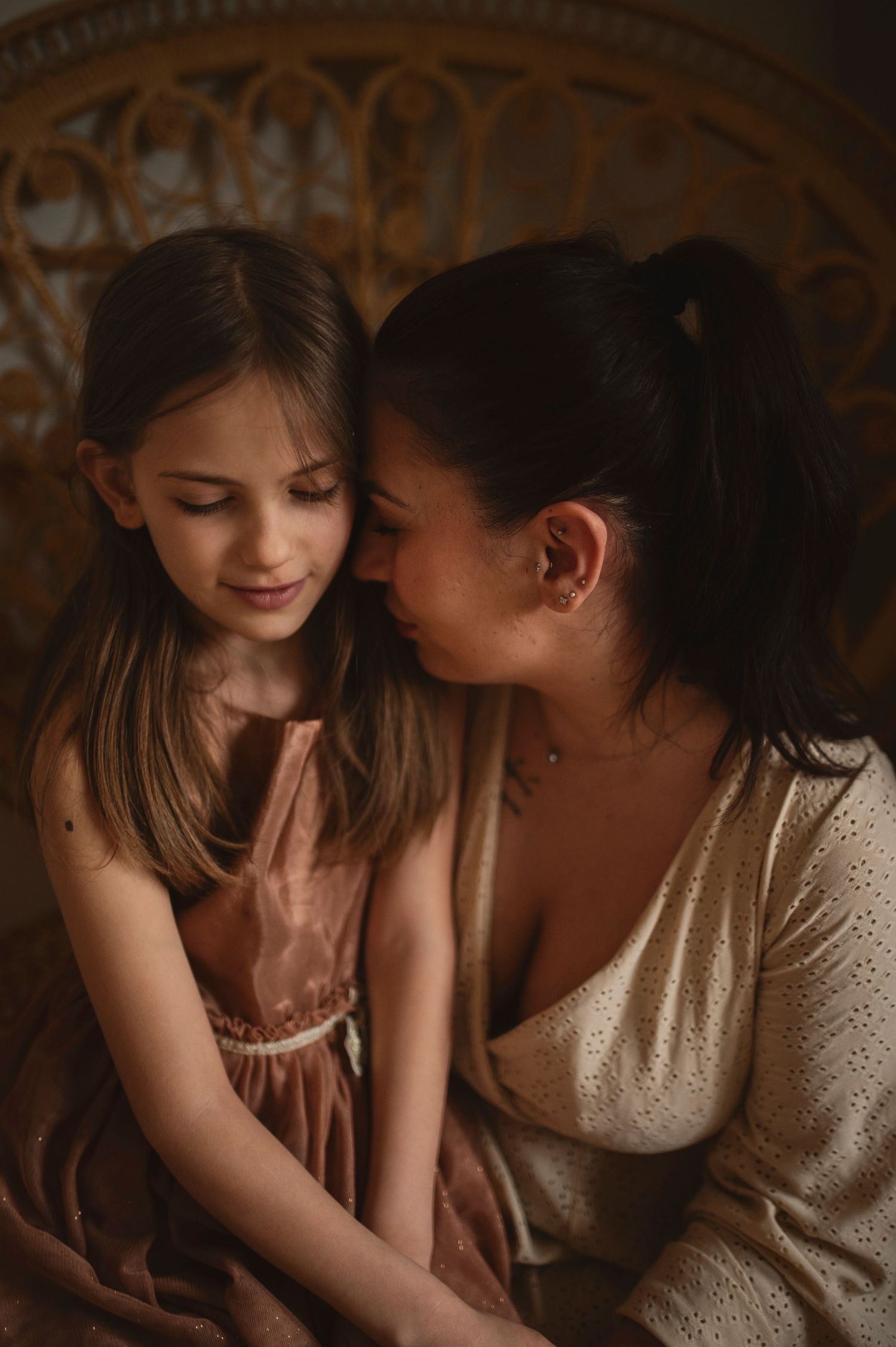Intimate portrait with soft lighting highlighting gentle expressions and natural connection.