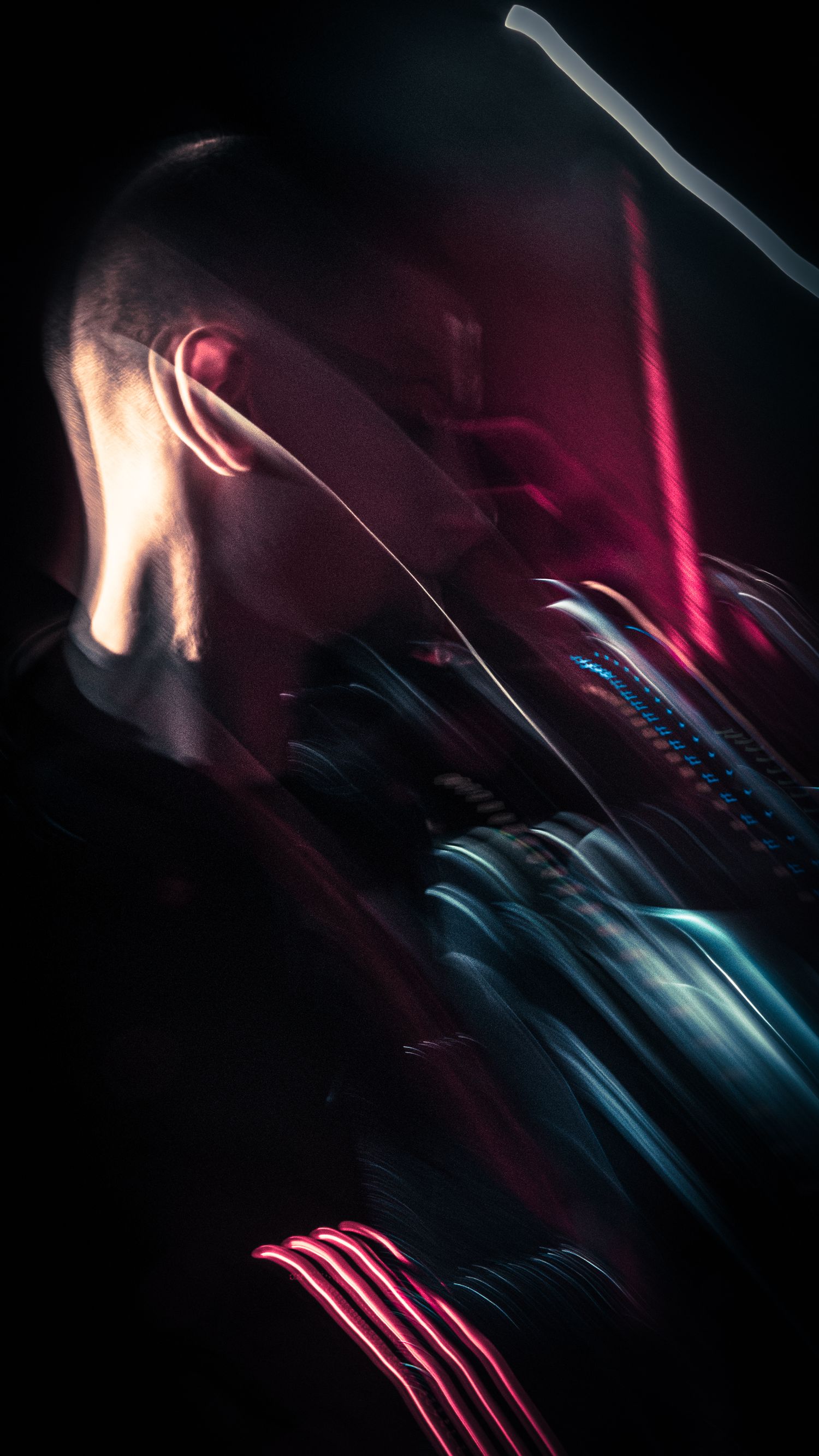 A cyberpunk-style portrait of a man with neon light streaks in red and teal against a dark background.