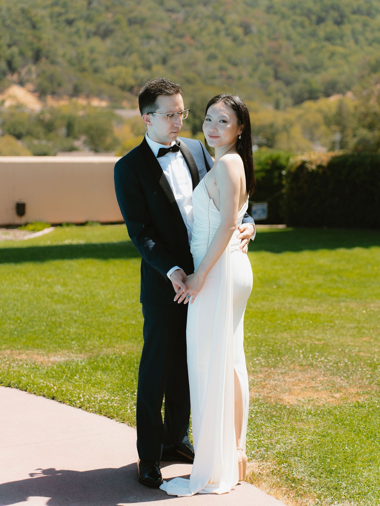 Elegant couple poses outdoors at the Marin County civic center for their civil ceremony photo shoot