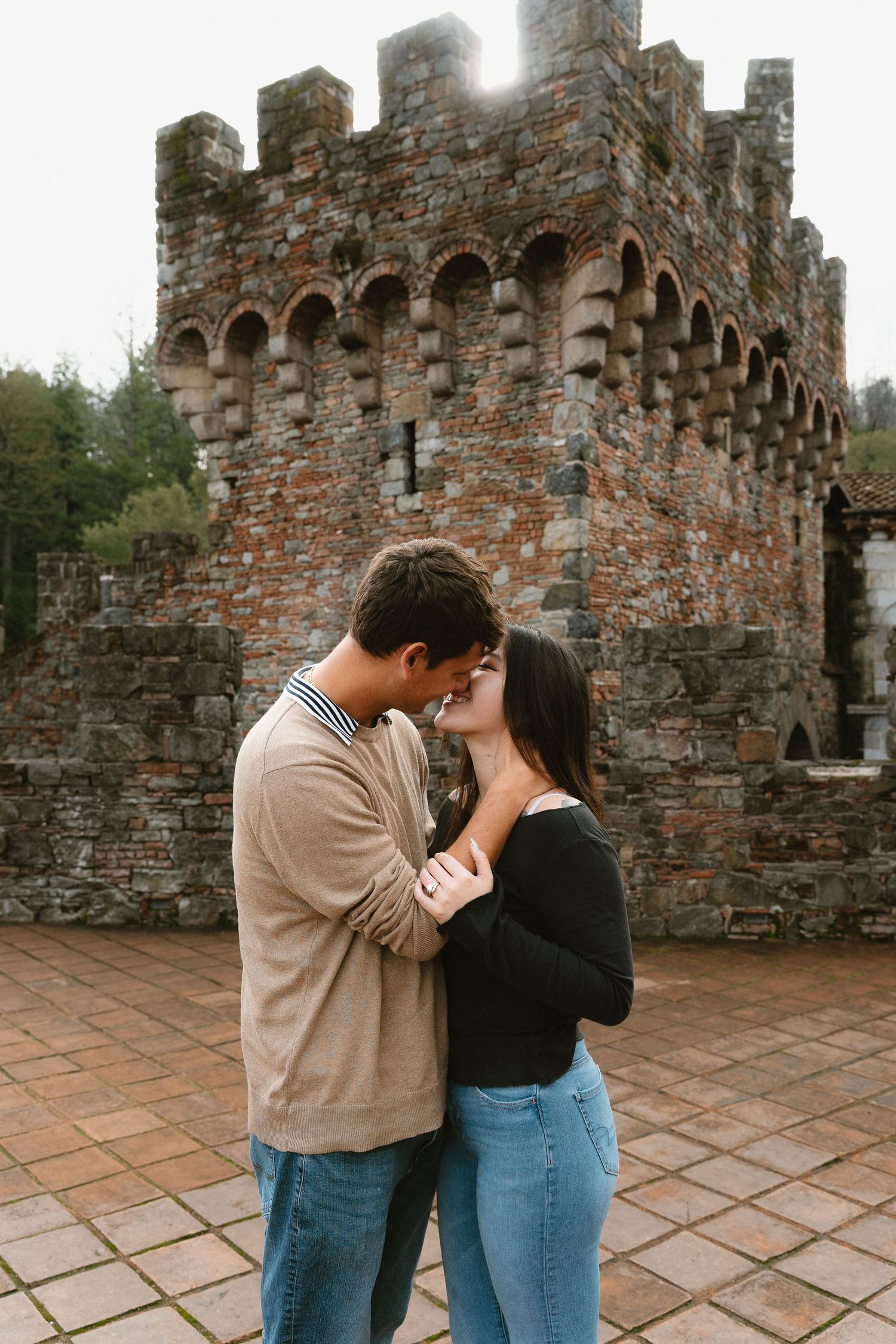 Napa Valley winery A romantic scene unfolds on a stone terrace with medieval castle architecture in the background.