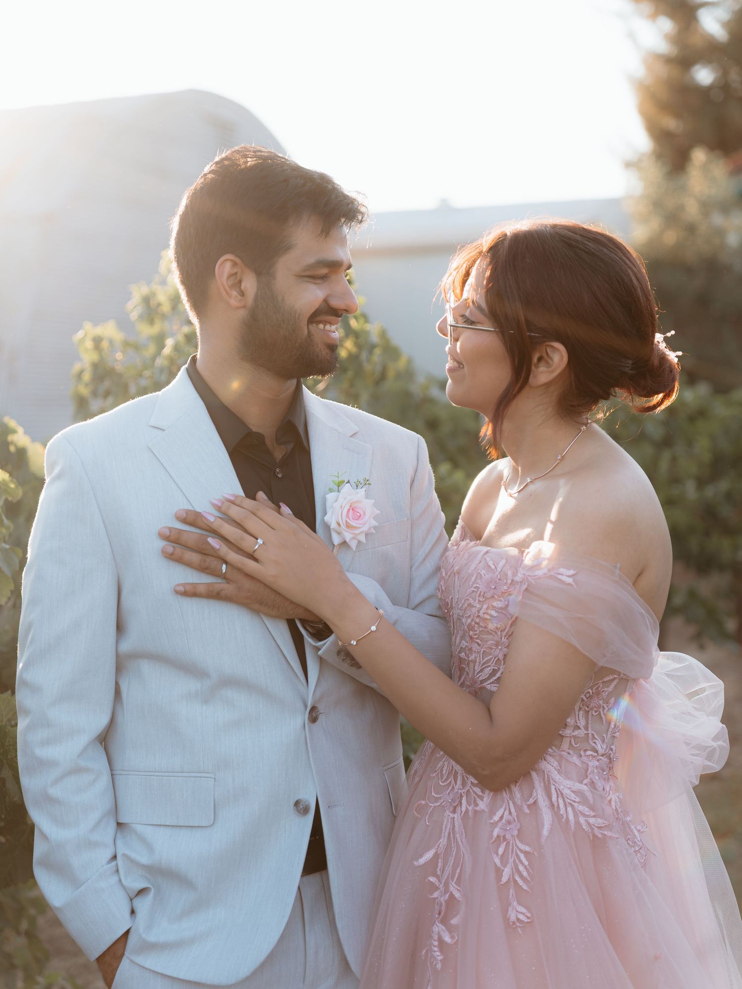 San Jose wedding couple show off their rings at their engagement party