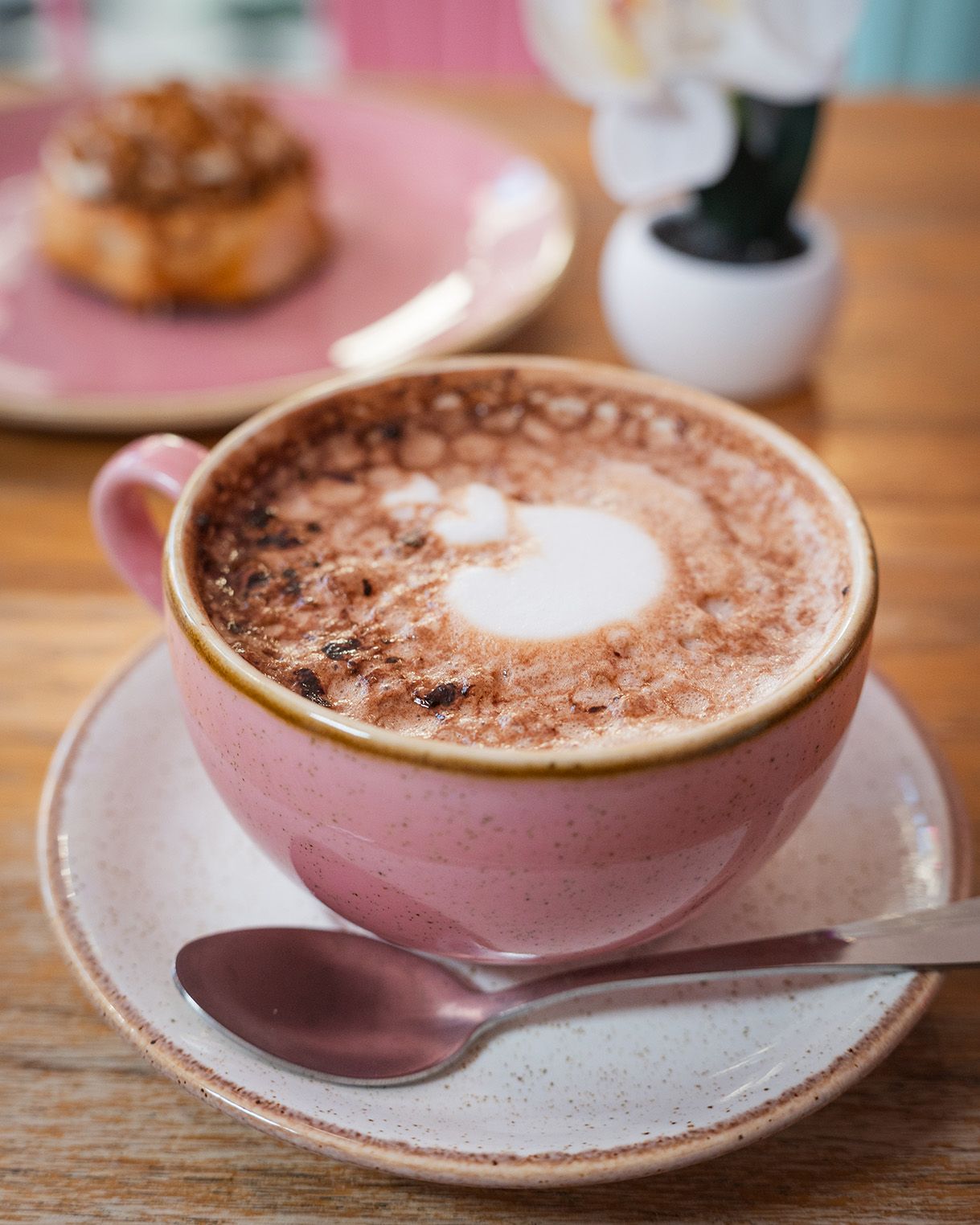 Close-up of a coffee in a pink cup at cinnammmm cafe