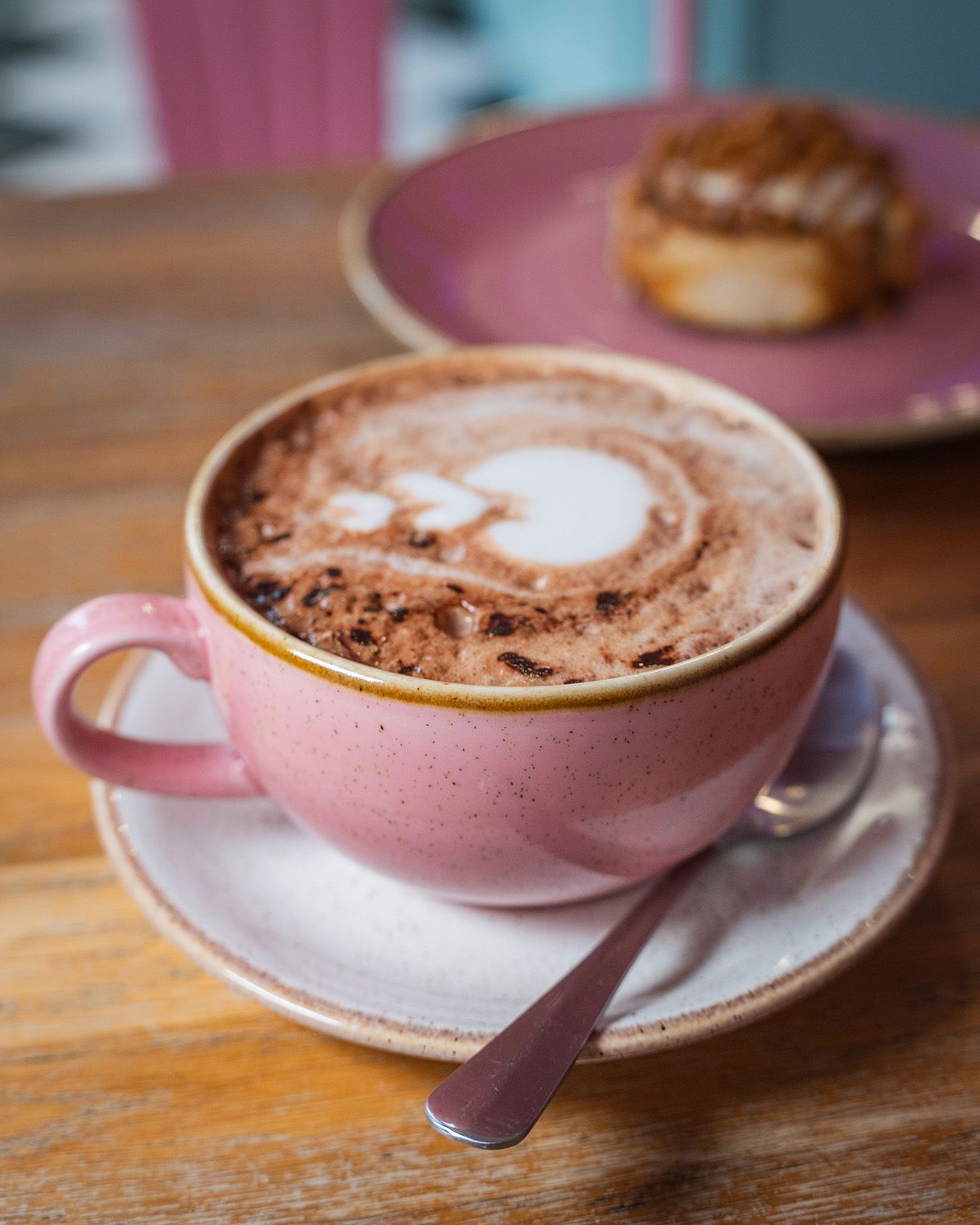 Close-up of a coffee in a pink cup at cinnammmm cafe