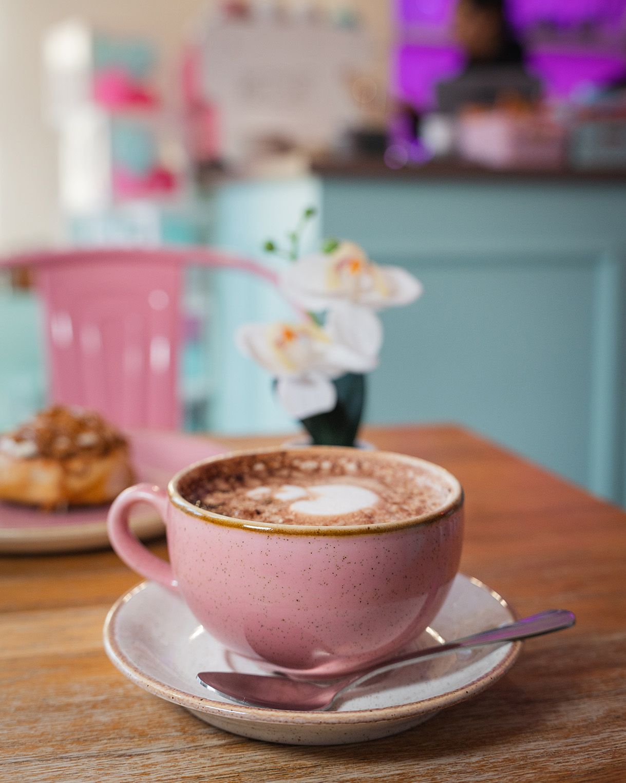 Close-up of a coffee in a pink cup at cinnammmm cafe