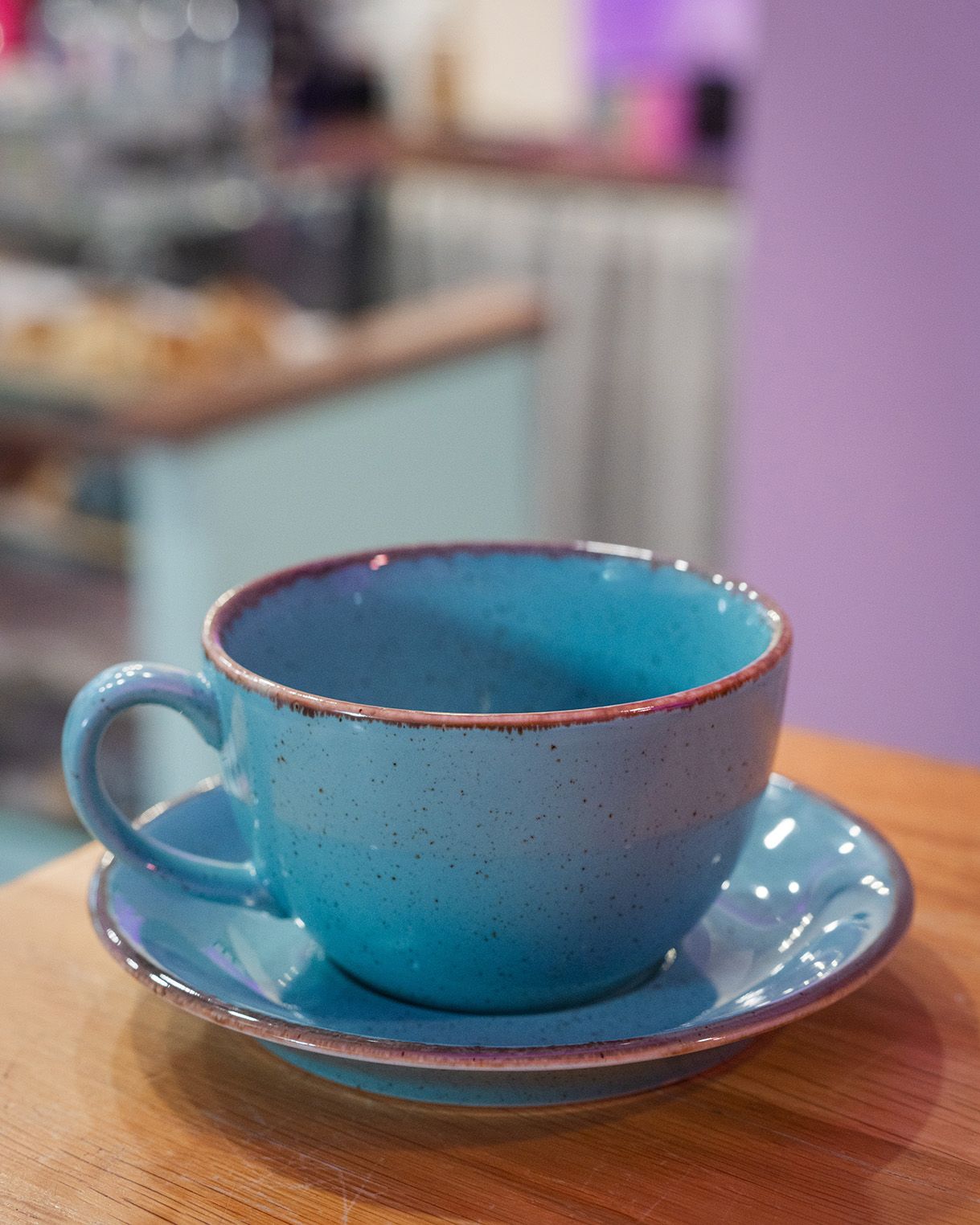Close-up of a blue cup on a blue saucer at cinnammmm cafe
