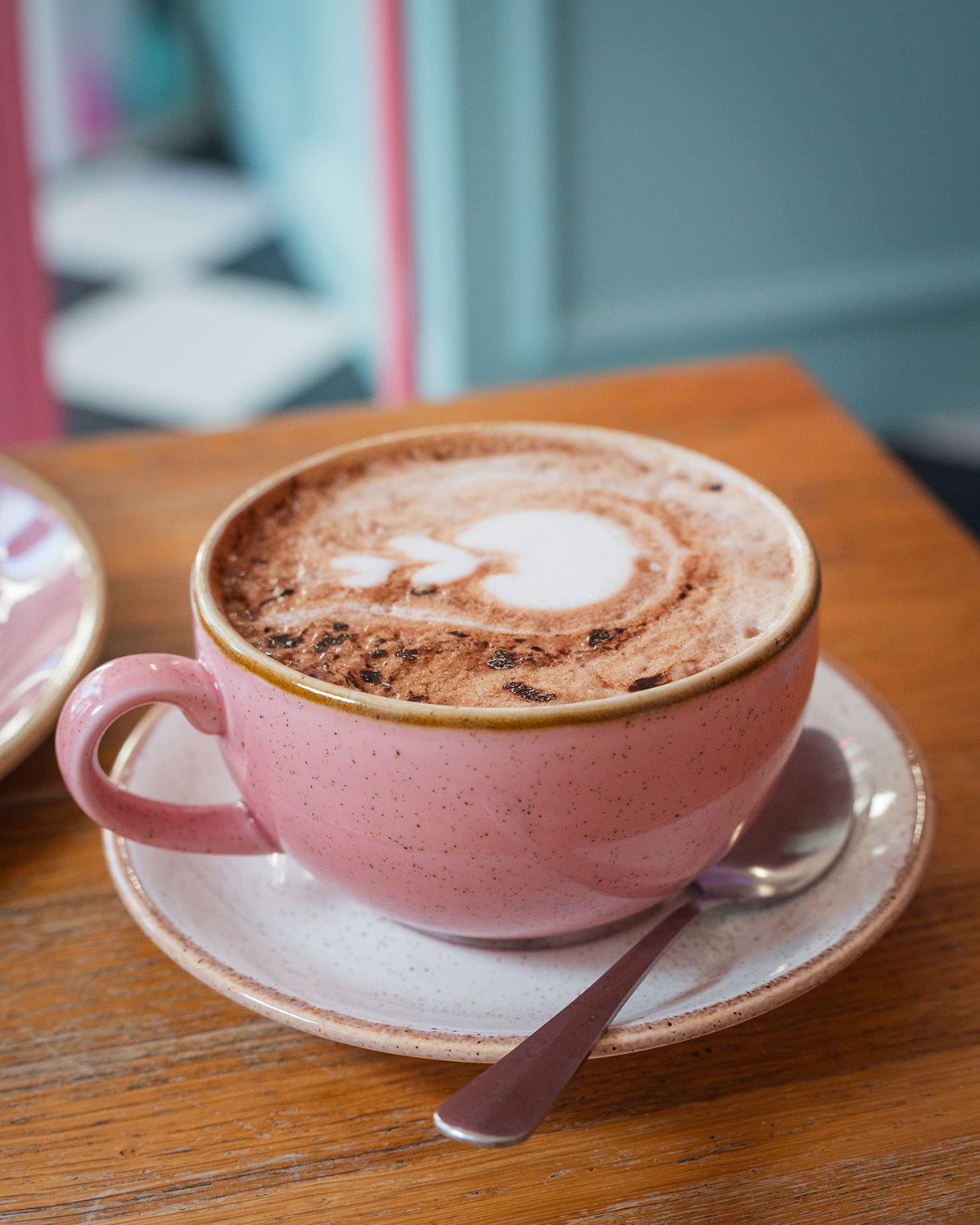 Close-up of a coffee in a pink cup at cinnammmm cafe