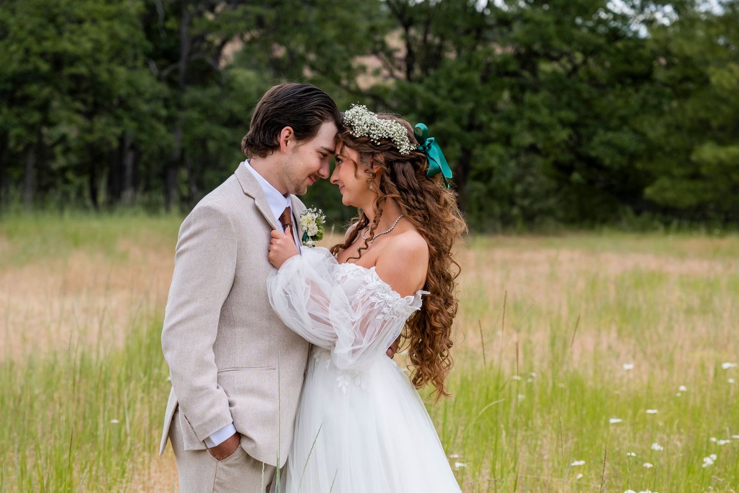 Bride and groom lean close and look into each other's eyes after their oregon wedding ceremony