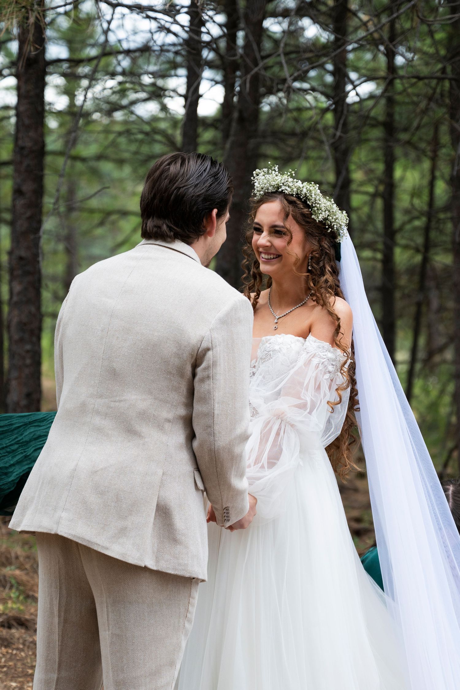 A bride smiles at the groom during an oregon wedding ceremony