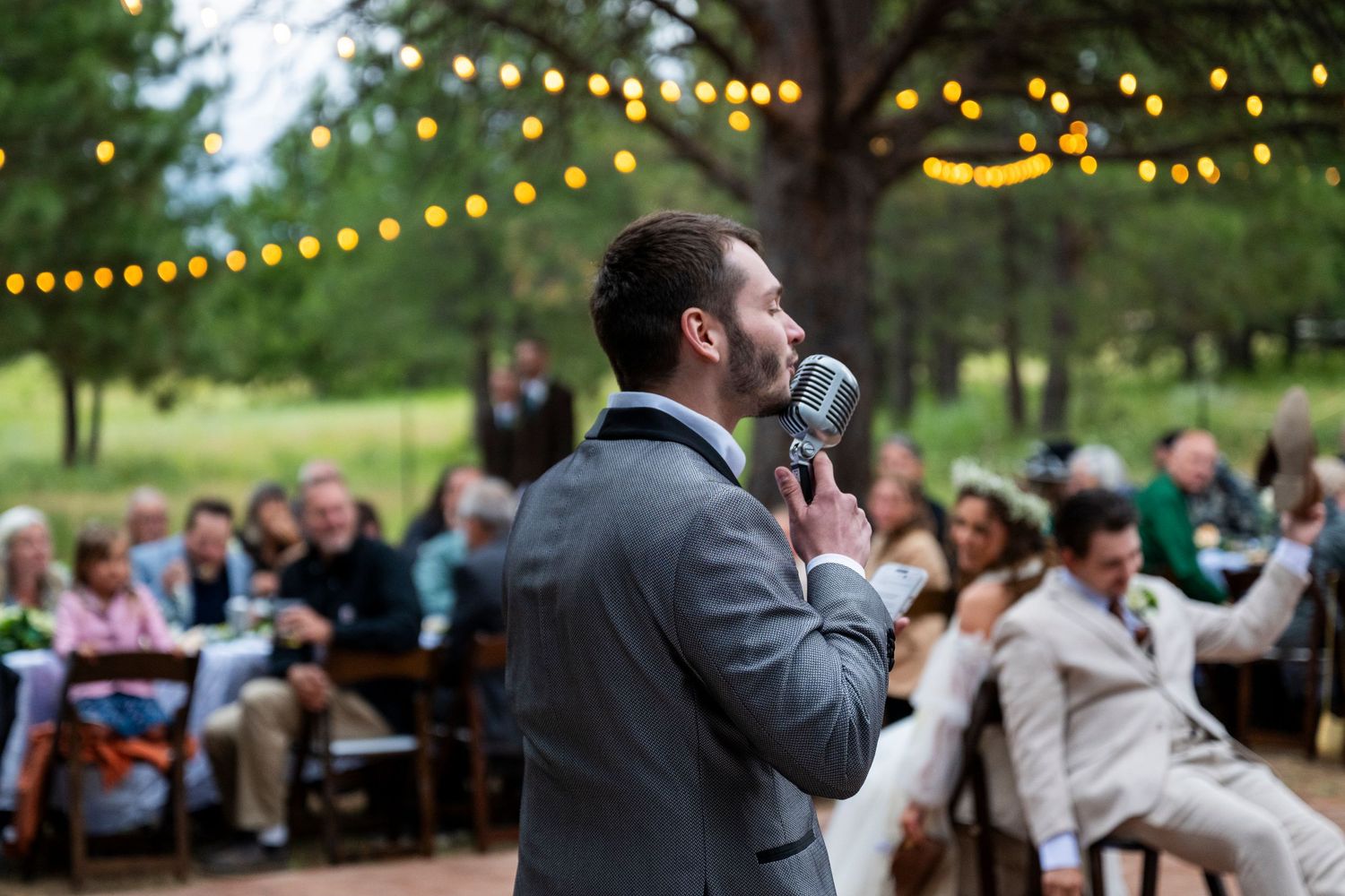 An MC talks into the microphone at an oregon wedding