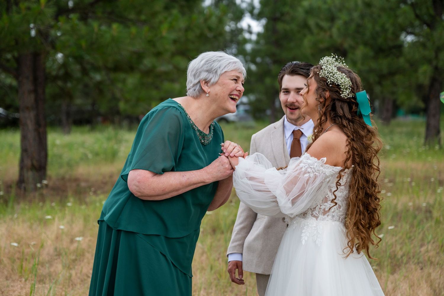 Bride and grandmother laugh during oregon wedding