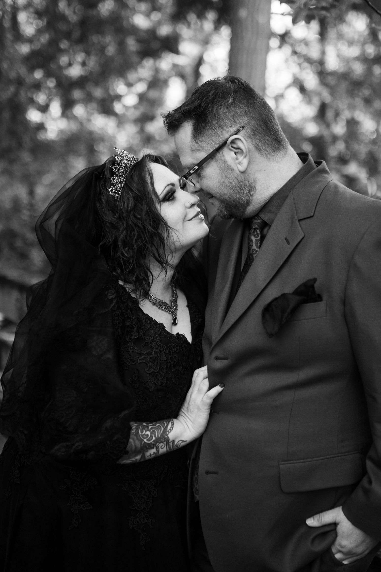 A romantic black and white photo sequence showing a couple in formal attire sharing intimate moments together.