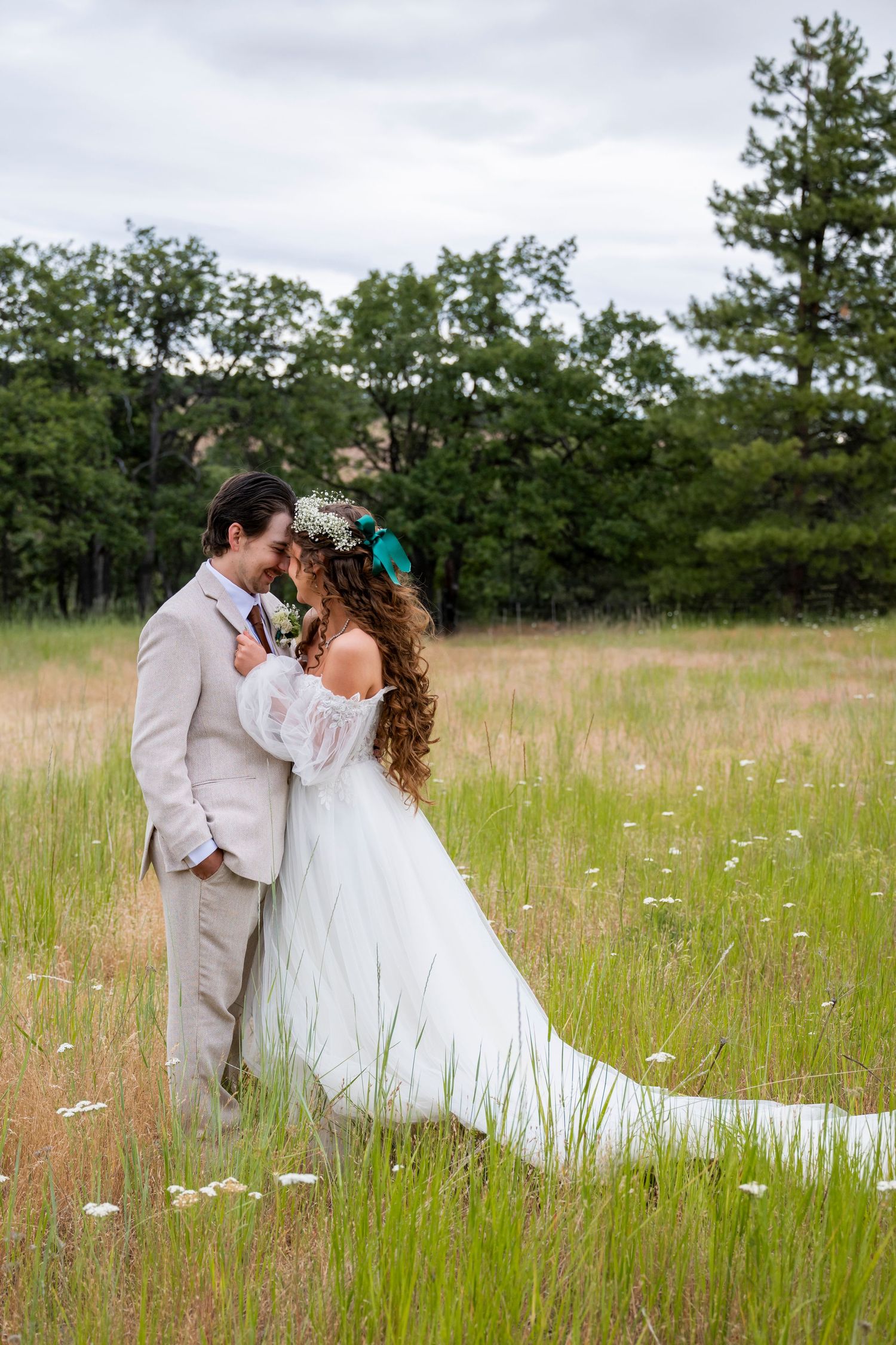 Bride and groom lean in for a kiss after their oregon wedding ceremony