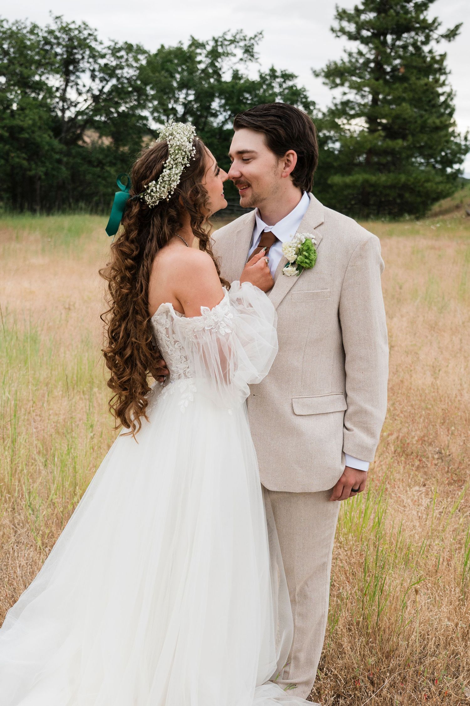Bride and groom smile at each other after their oregon wedding ceremony