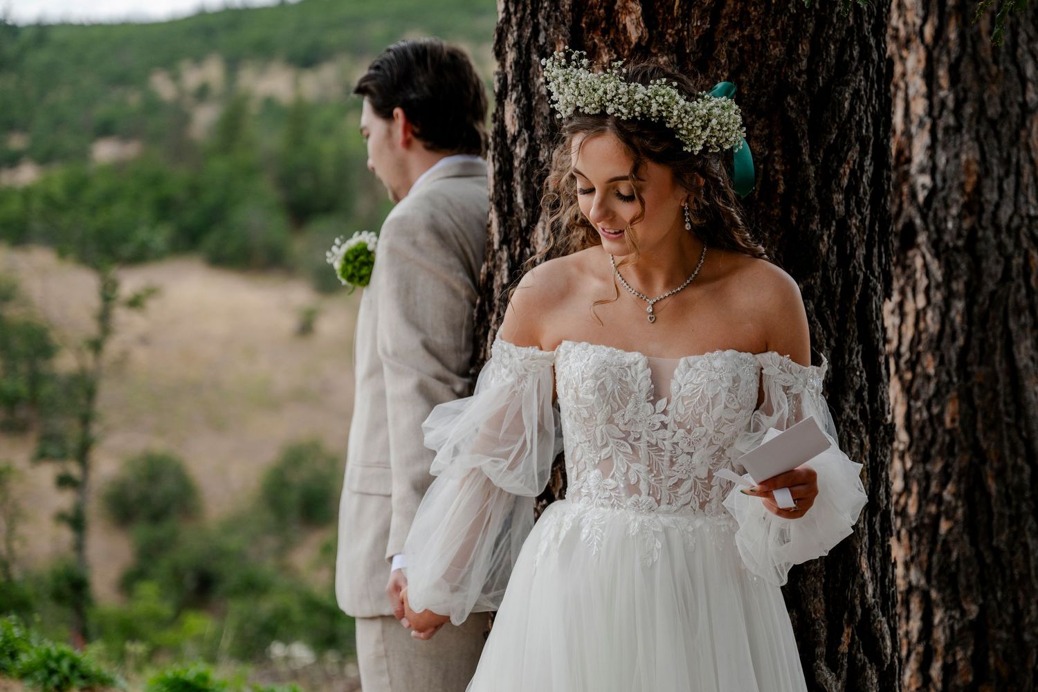 An oregon bride and groom hold hands during the first touch before their wedding ceremony