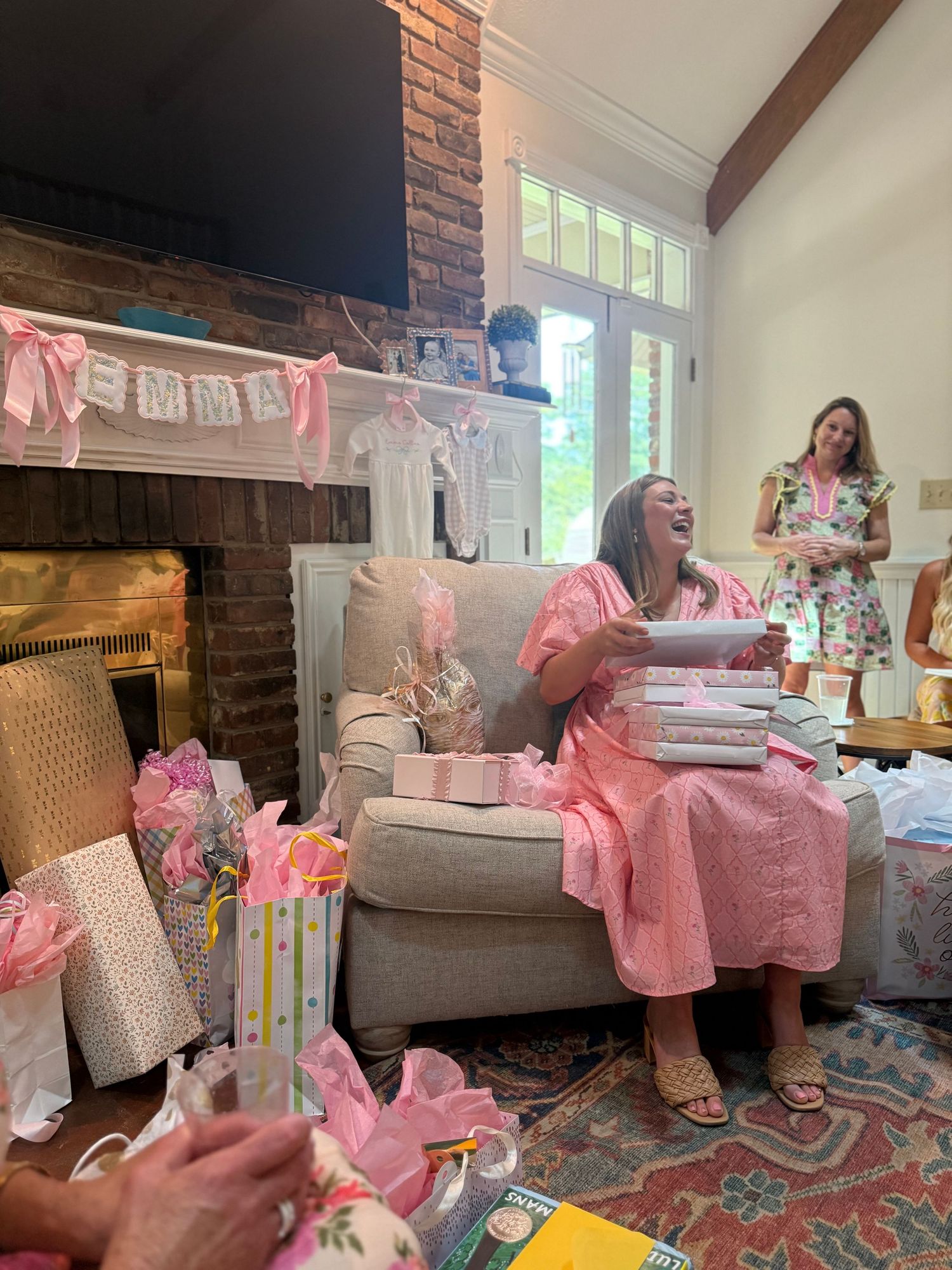 baby shower content creation of pregnant mother to be opening gifts