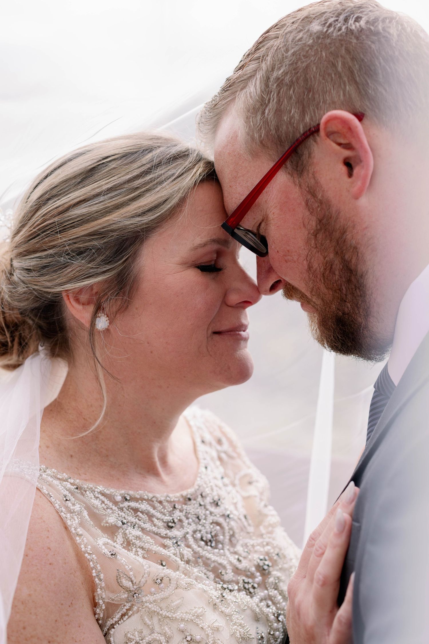 photo of couple in veil