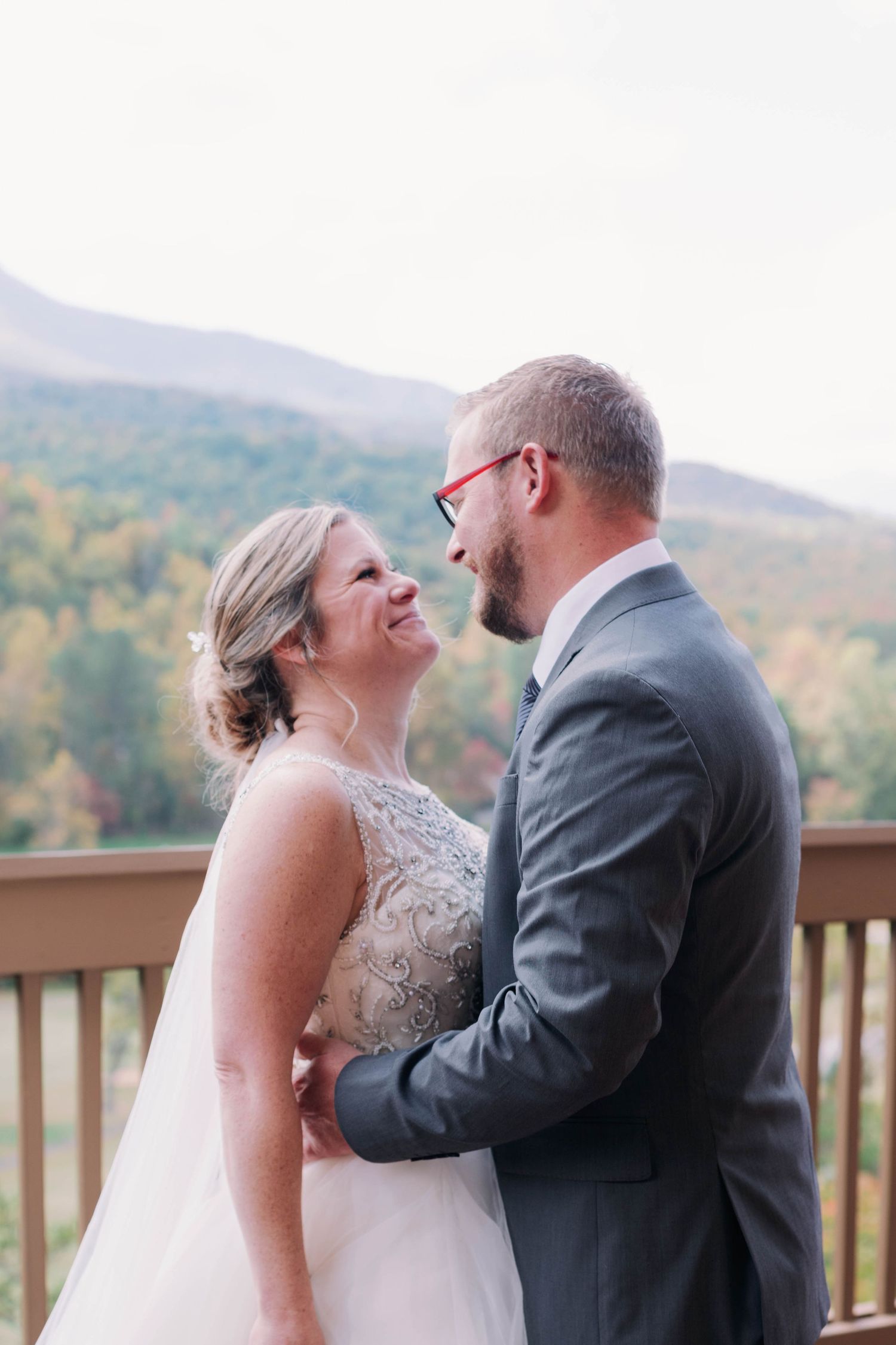 bride and groom look at each other and smile