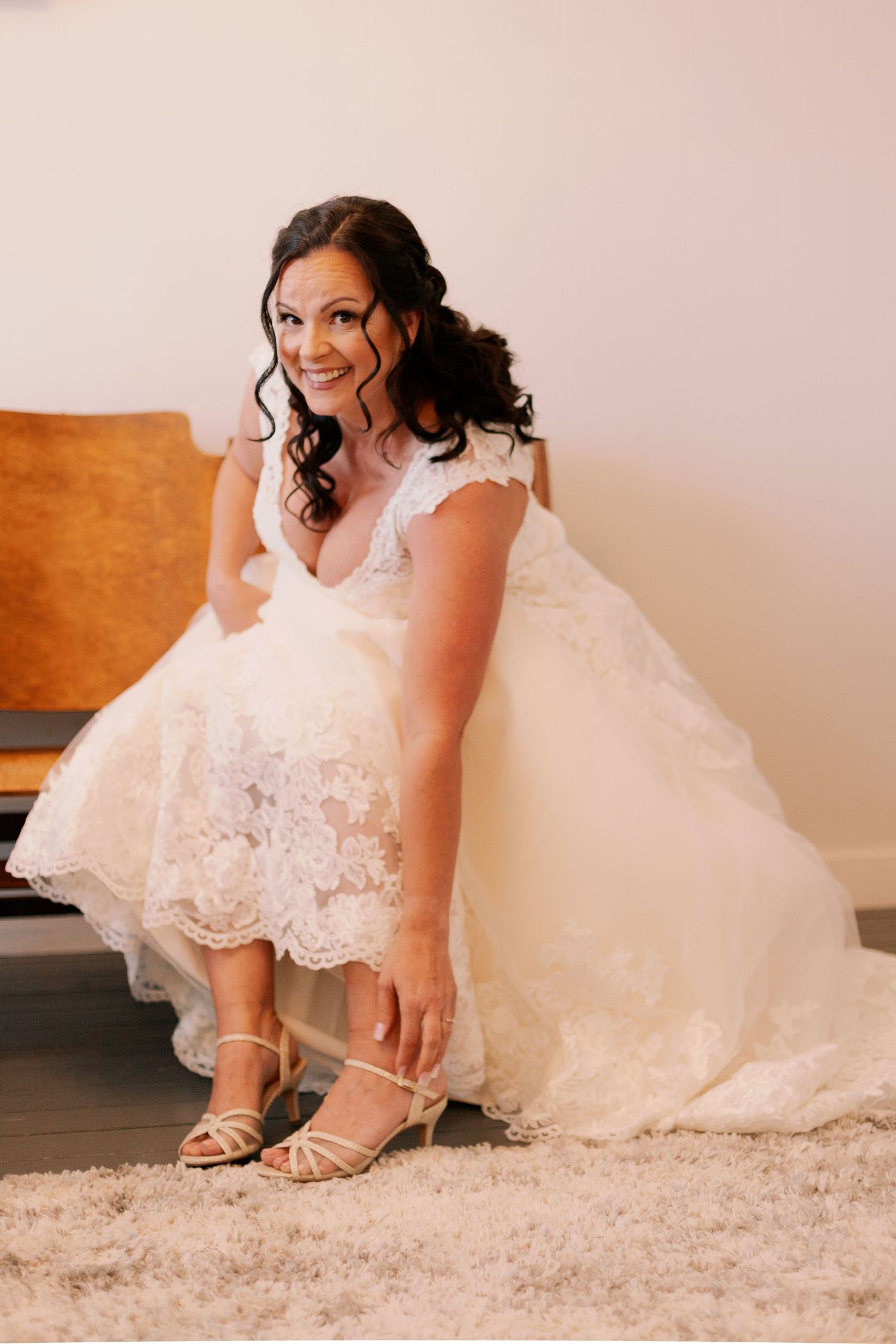 bride getting ready with shoes