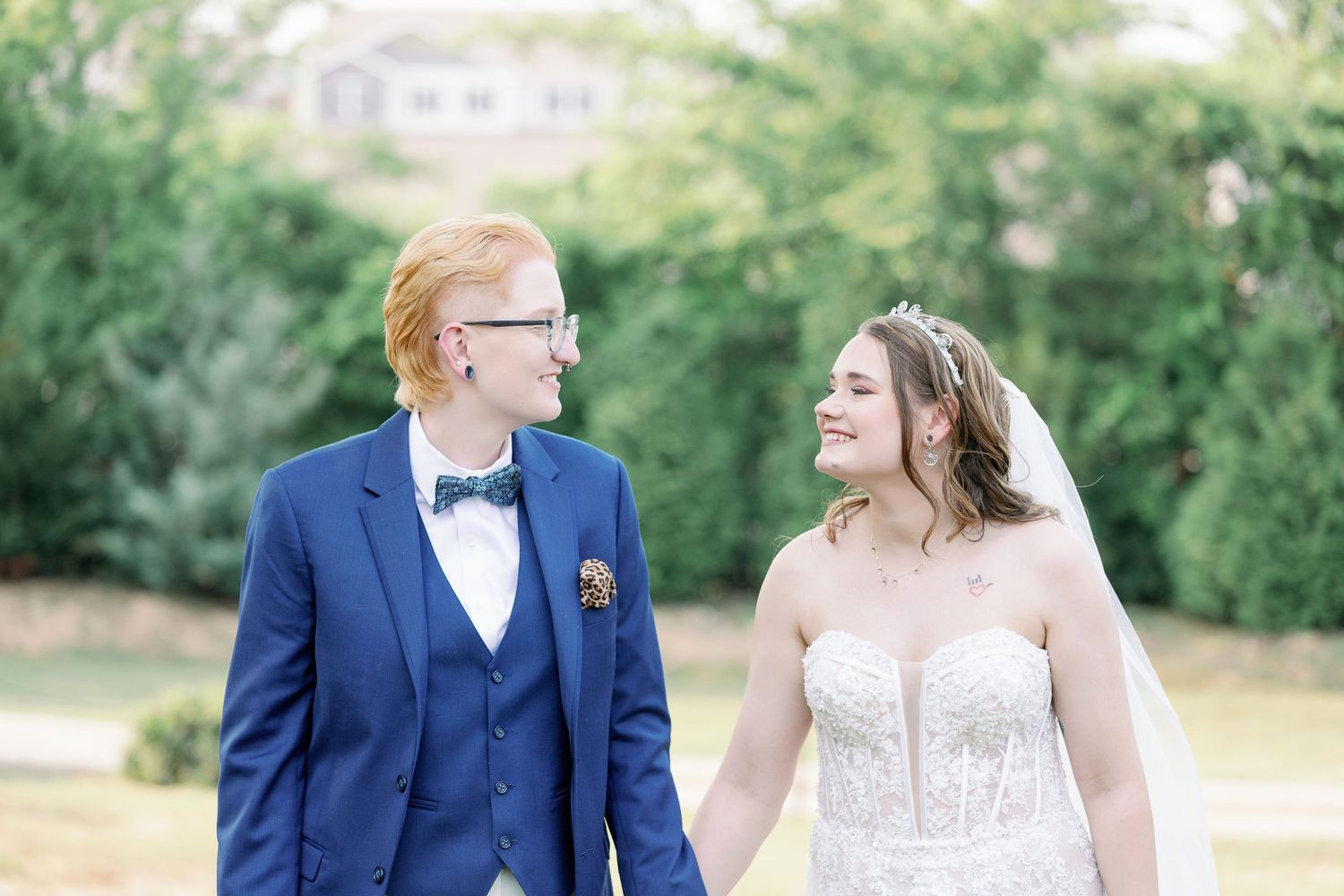 brides walk together and look at each other