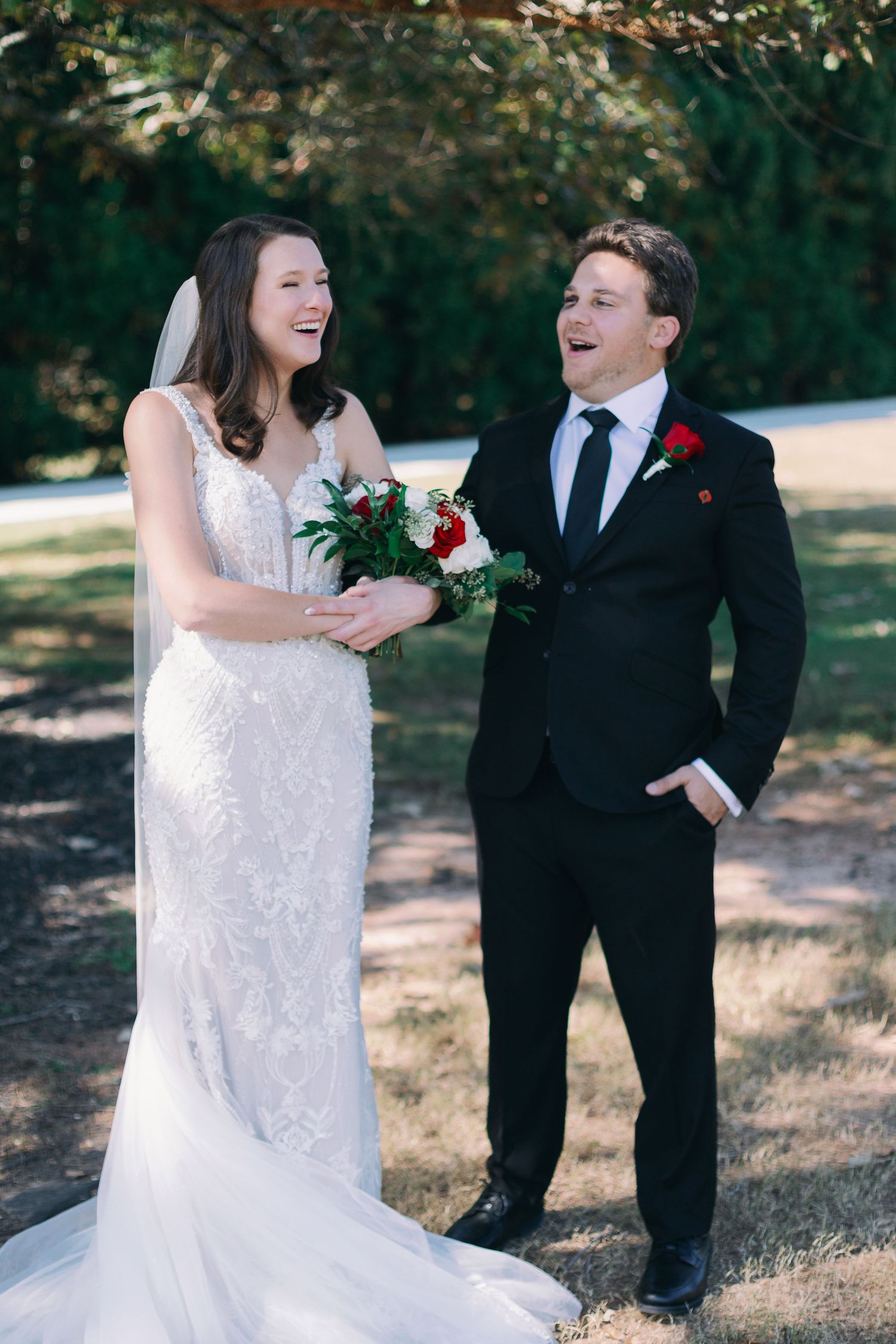 bride and groom laugh playfully in photo together