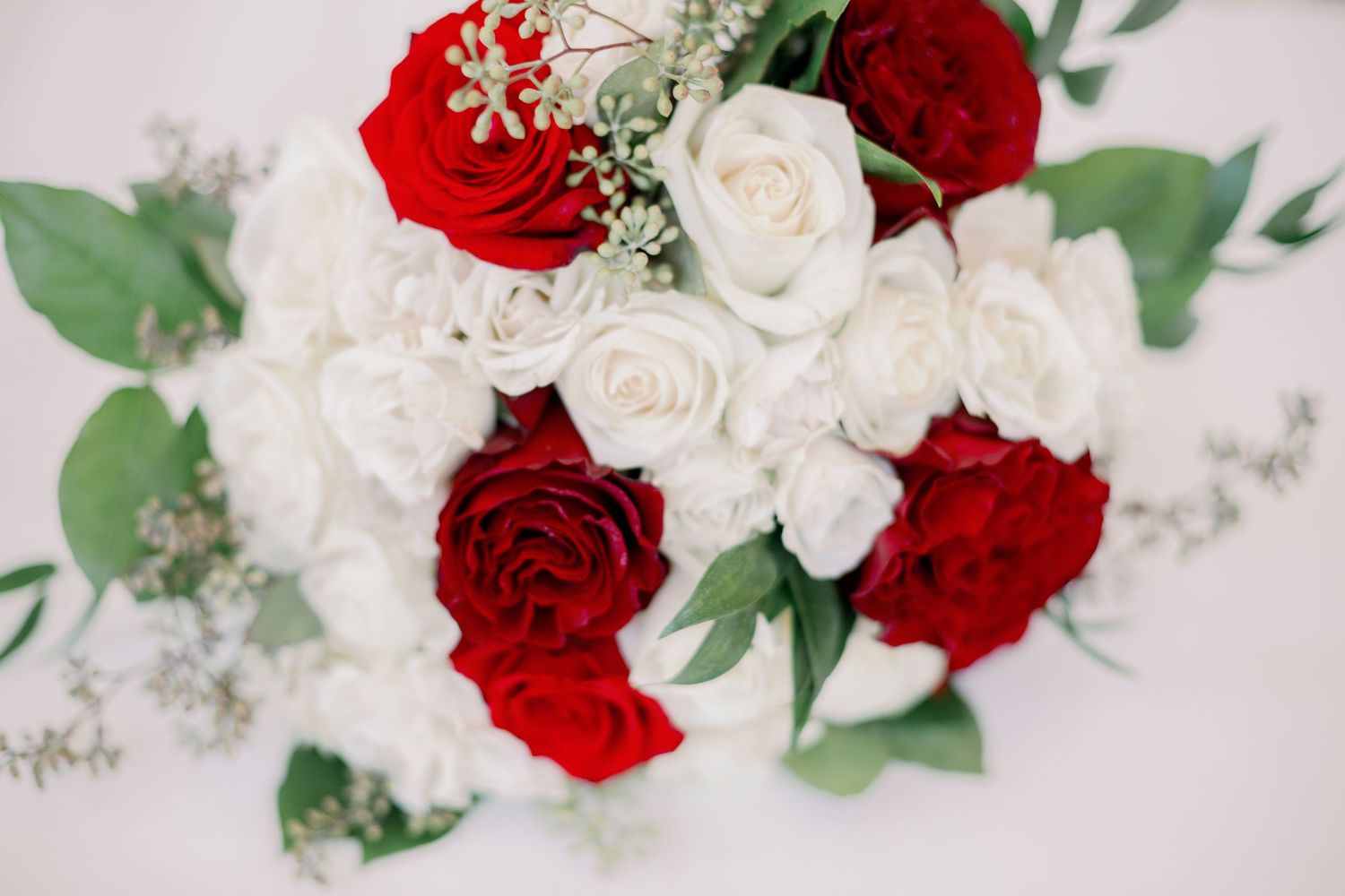 bridal bouquet showing red and white roses