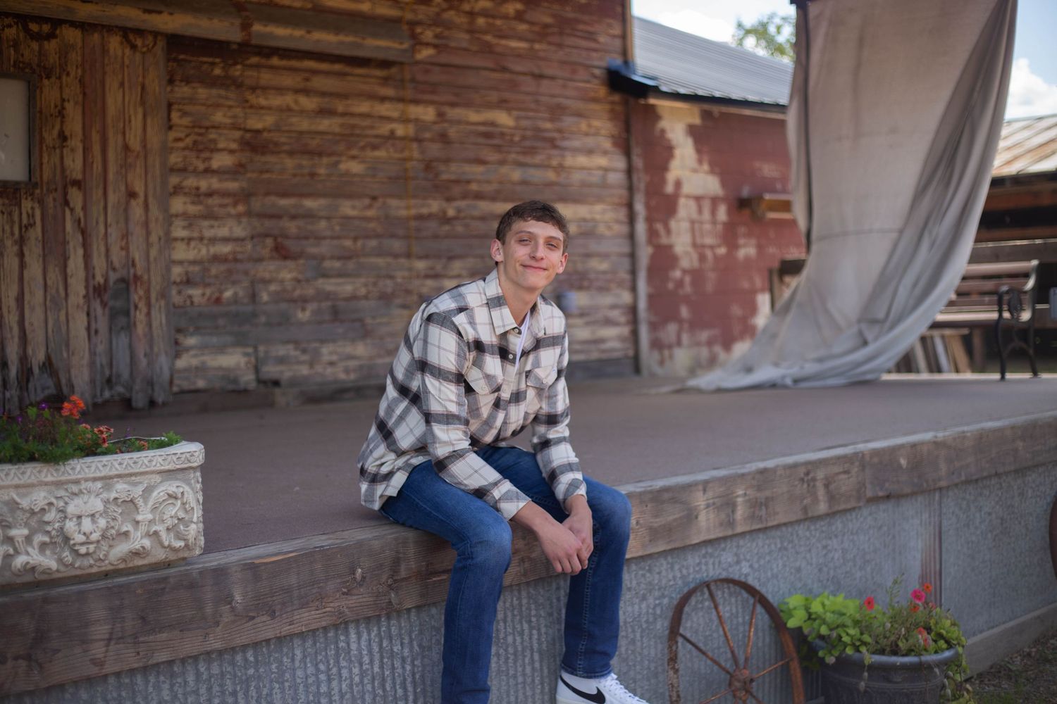Casual portraits against rustic brick and stone walls outdoors. Mauston photographer.