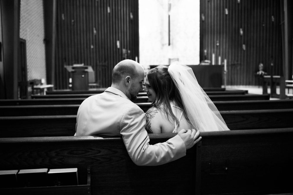 Artistic black and white photography series capturing intimate moments in low light. Mauston photographer.