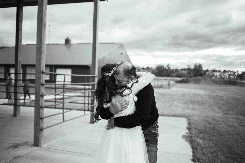Black and white photos showing silhouettes of people dancing and celebrating outdoors. Mauston photographer.