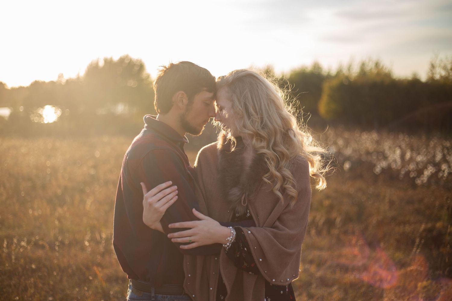 Romantic sunset photoshoot in golden field with lens flare. Mauston photographer.
