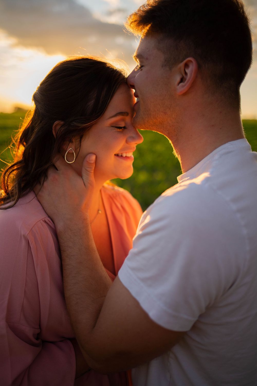 Romantic sunset silhouette photos capturing an intimate moment between a couple. Mauston photographer.