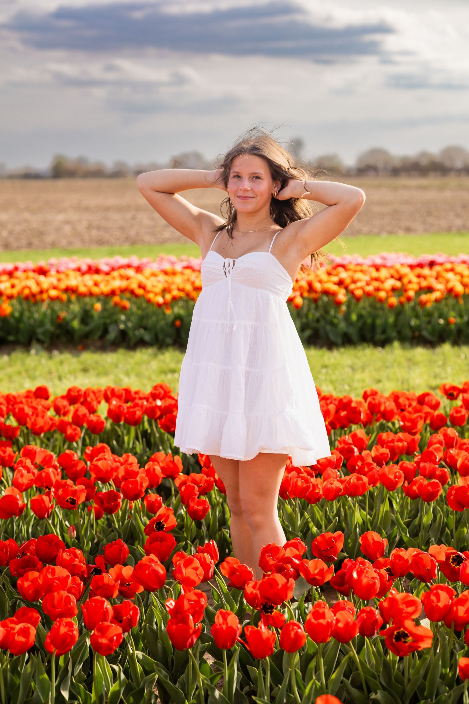 High school senior portrait at Exploration Acres tulip fields in Lafayette, Indiana by Willow Lane Photography.