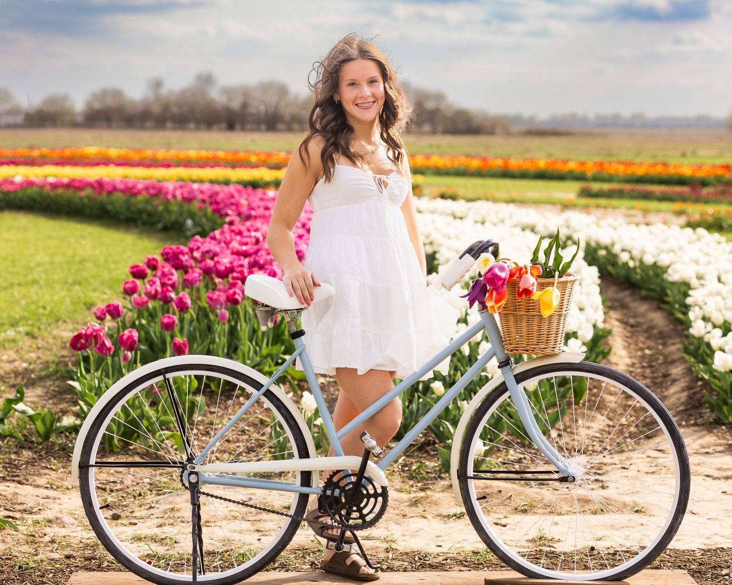 Tulip field session for high school senior portrait at Exploration Acres in Lafayette, Indiana by Willow Lane Photography