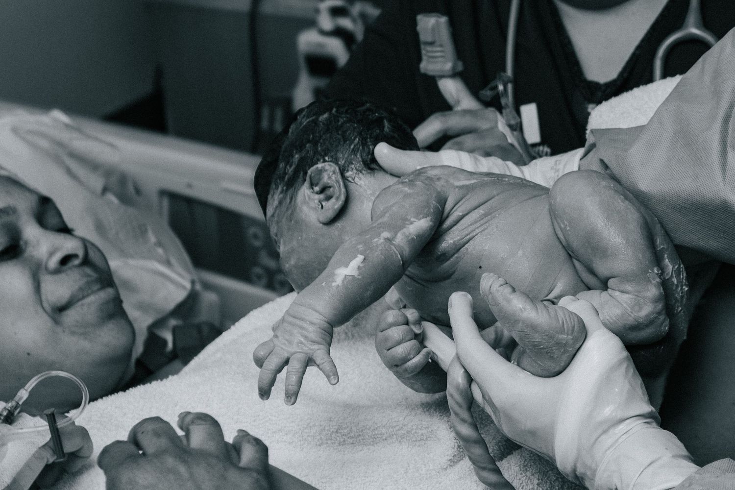 Killeen Birth Photographer captures mother being handed her newborn baby for the first time.