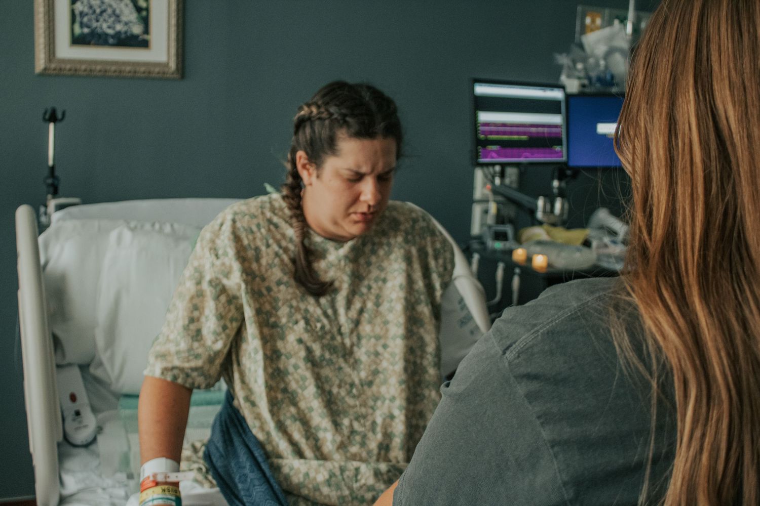 Georgetown mom supported by Christian doula with rebozo during hospital birth.